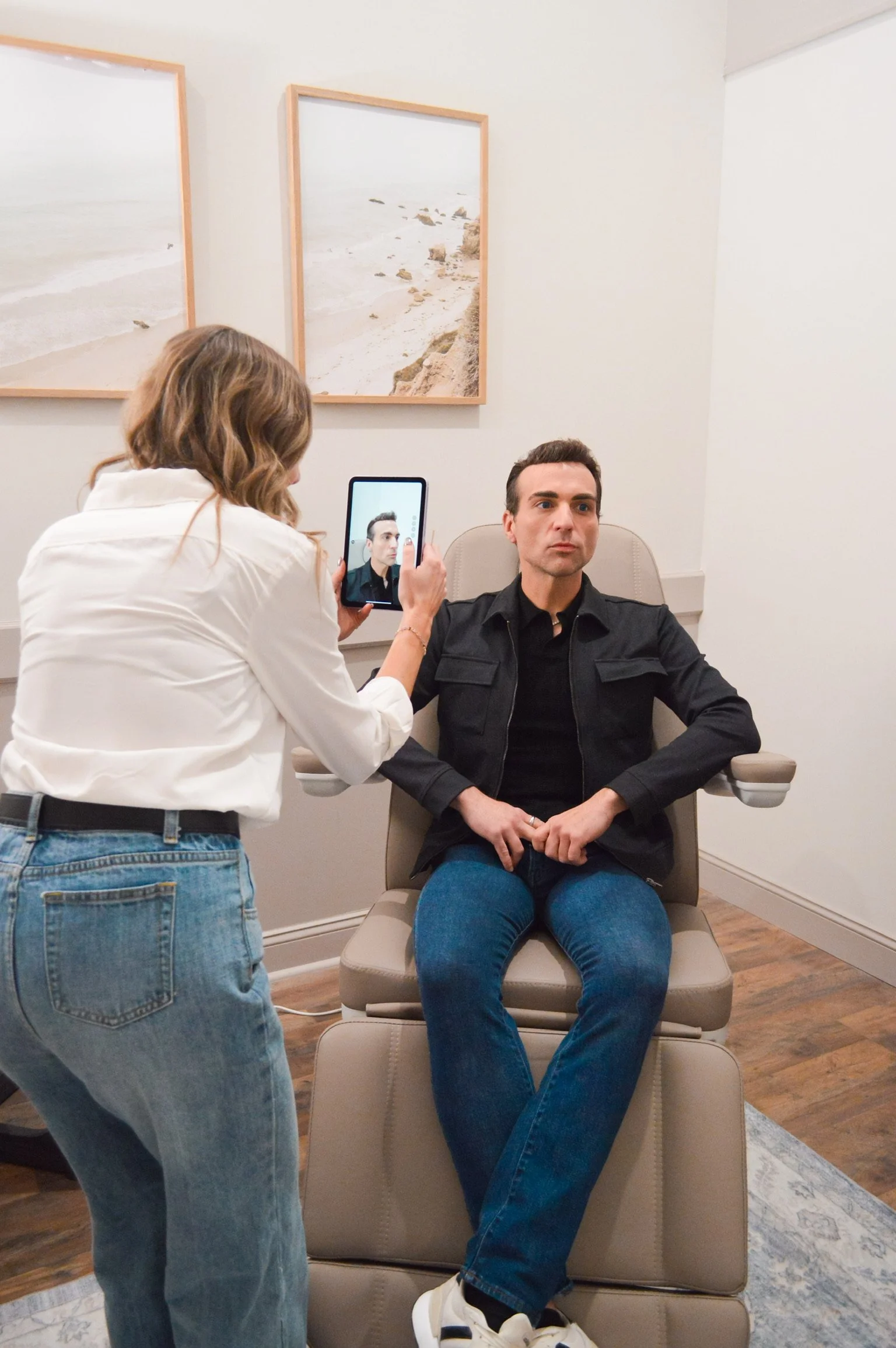 photo of woman taking a photo of a man