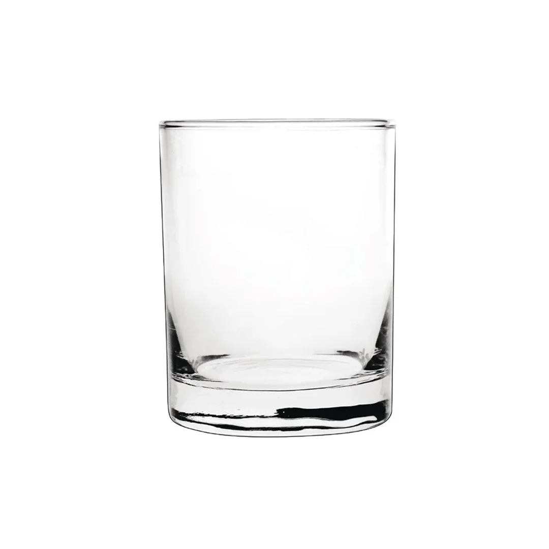 Empty clear glass tumbler on a plain white background.