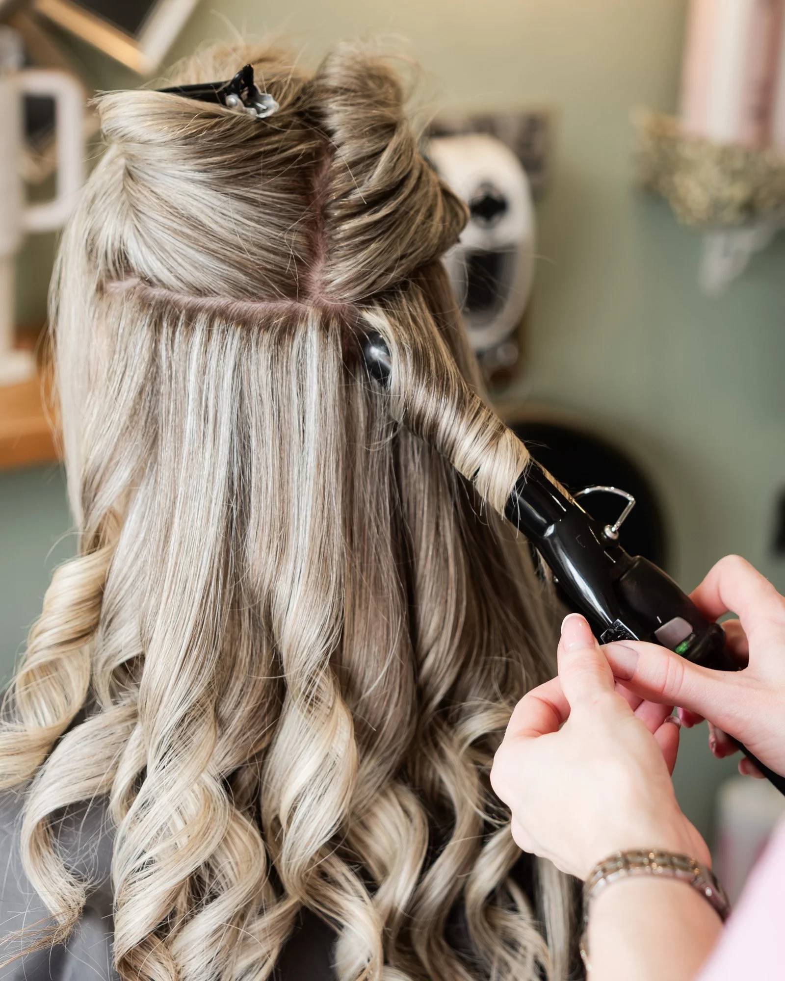 Detail photograph of Casey working on a Client's hair styling at Hair at Suite 7