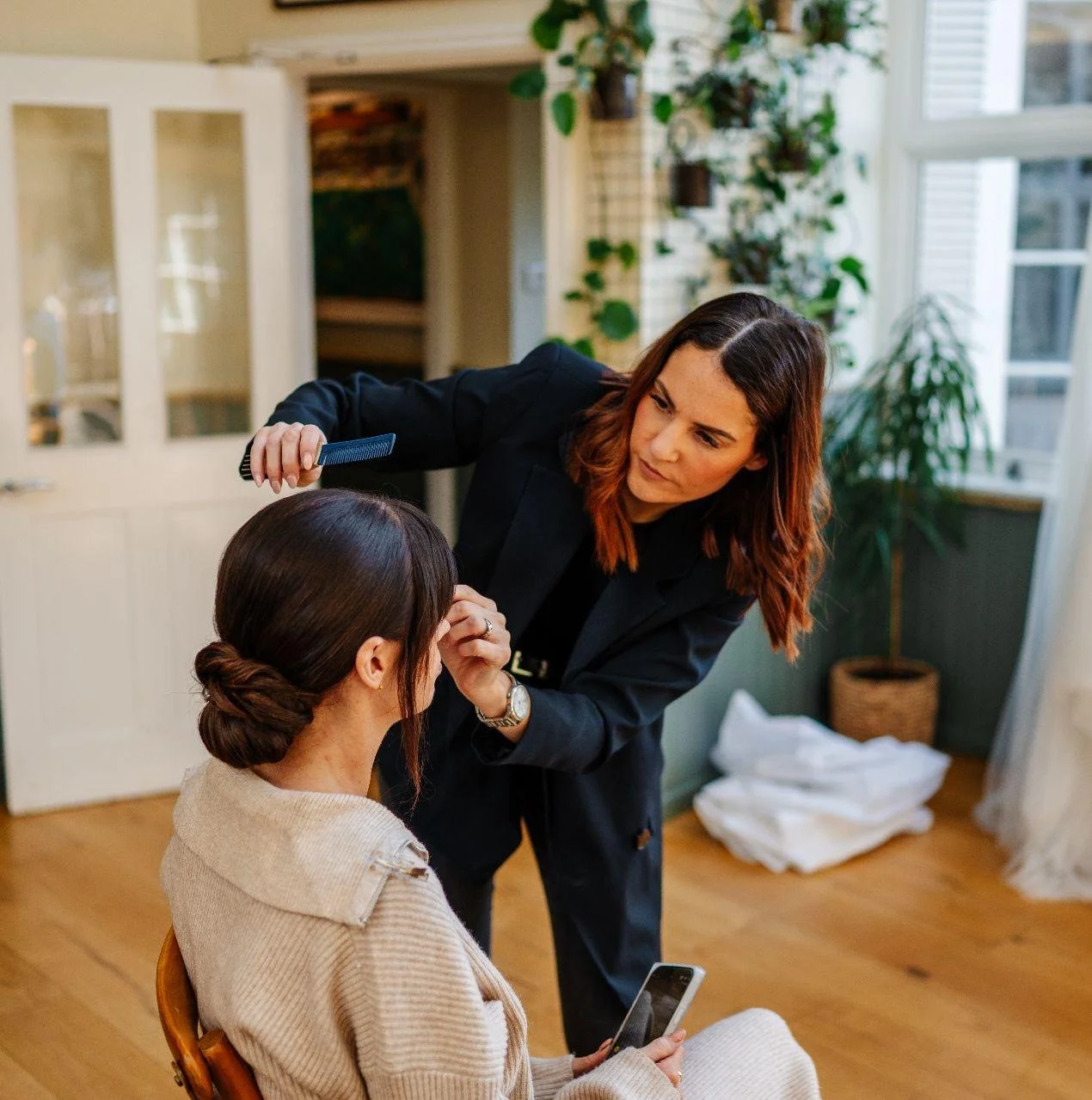 Action shot of Amber, a hair stylist at Hair at Suite 7