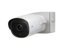 Wireless outdoor security camera mounted on a wall