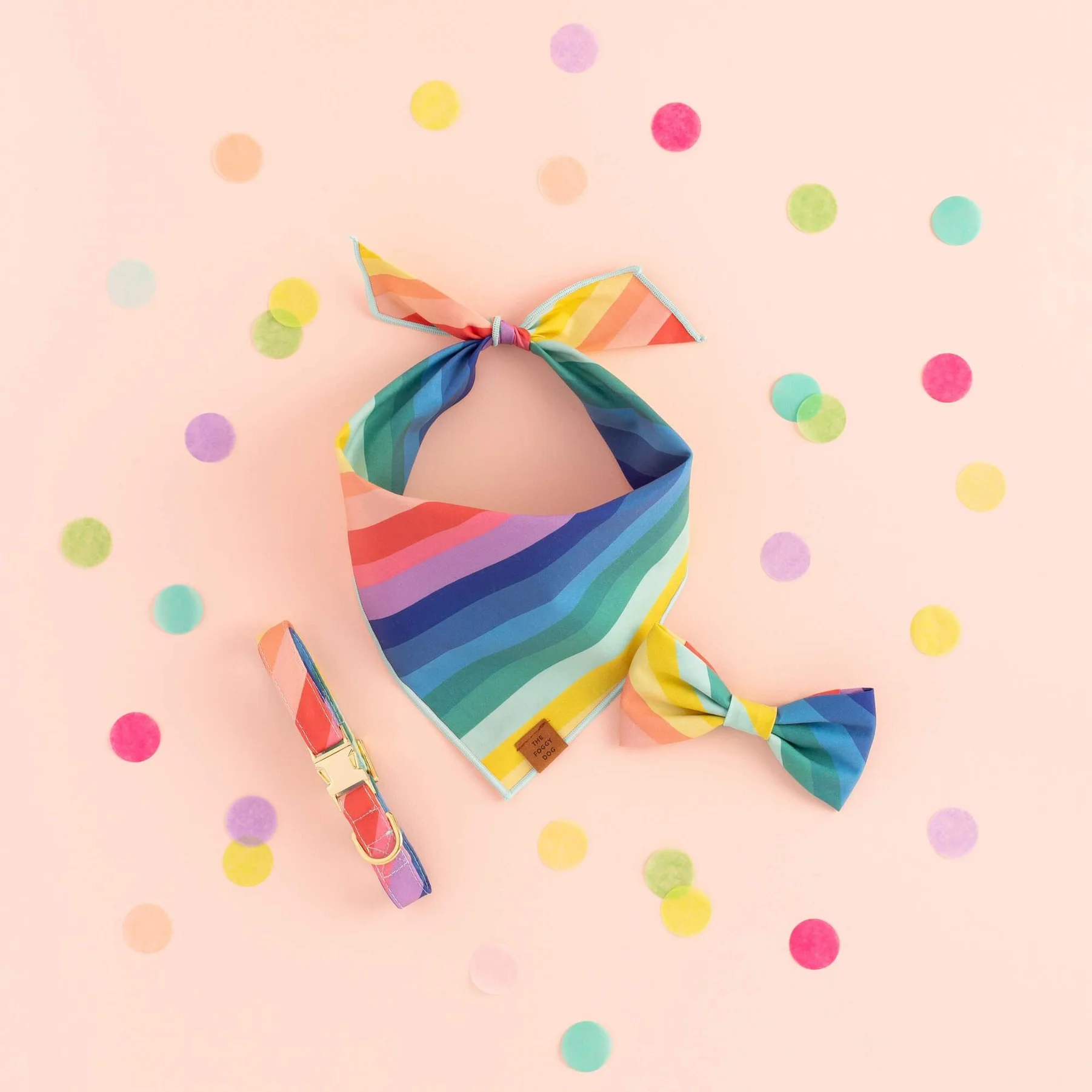 A colorful rainbow striped dog bandana and bow tie set, perfect for pet-friendly birthday party supplies in Seattle’s Madrona and Madison Park neighborhoods.