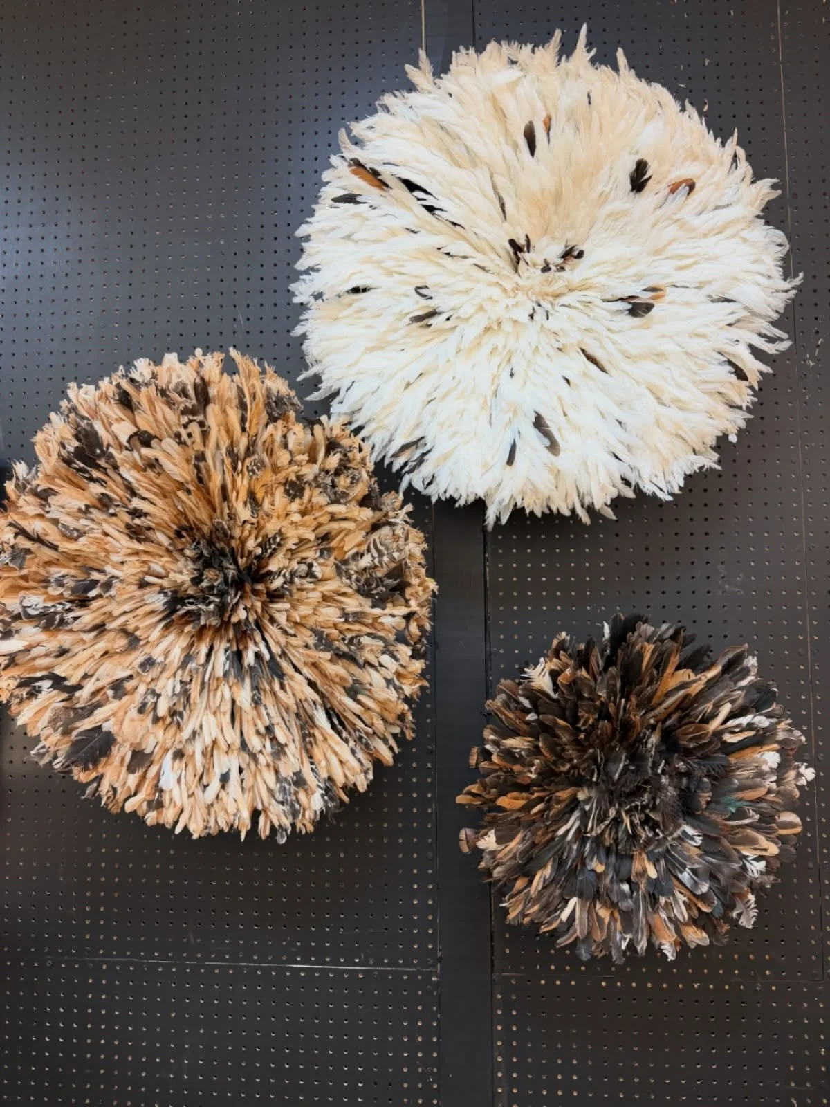 soft feathers. bold presence. 🤎
these one-of-a-kind juju hats symbolize prosperity, abundance, and the graceful beauty of birds &mdash; while making one unforgettable wall statement.
available in multiple colorways and sizes in store to help create 