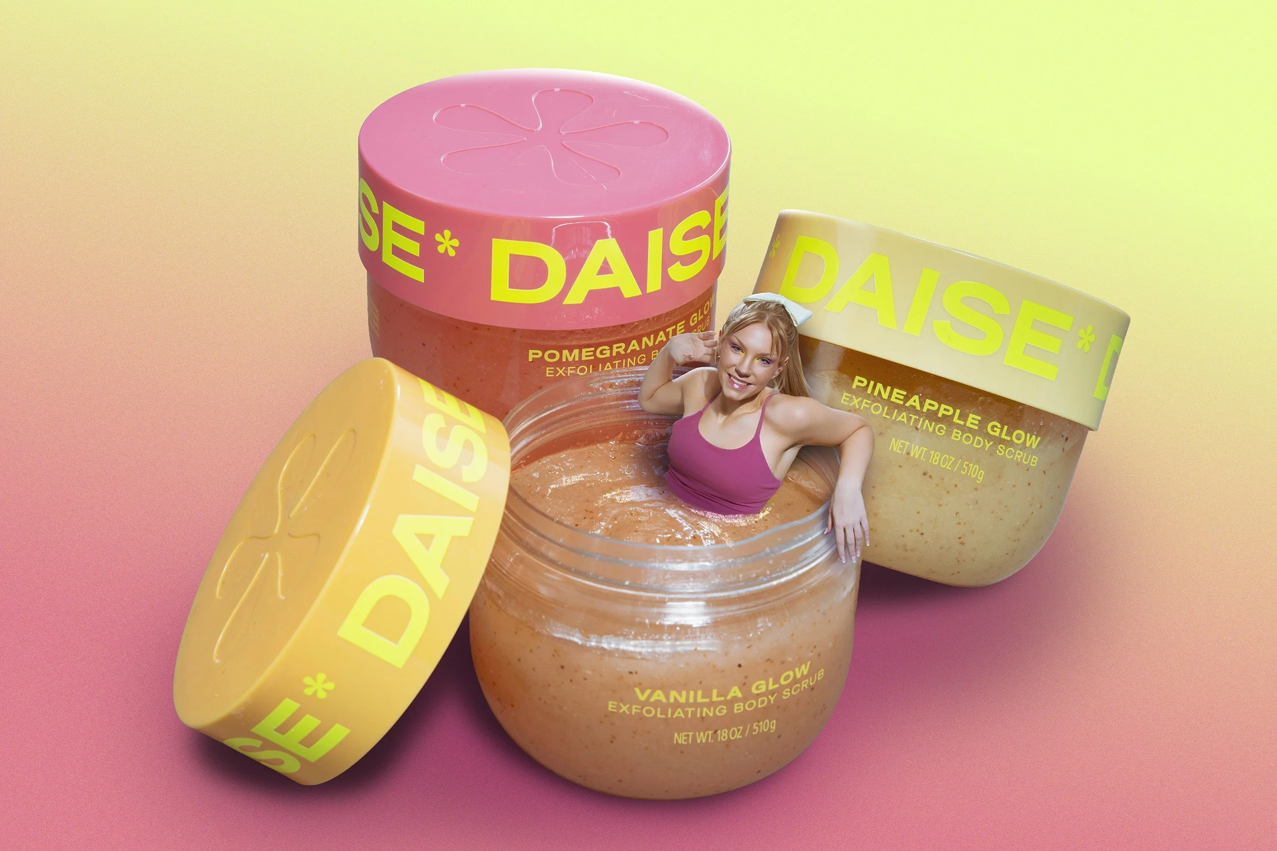Display of three skincare products with bright colors and a woman smiling in a pink tank top, set against a pink and yellow gradient background.