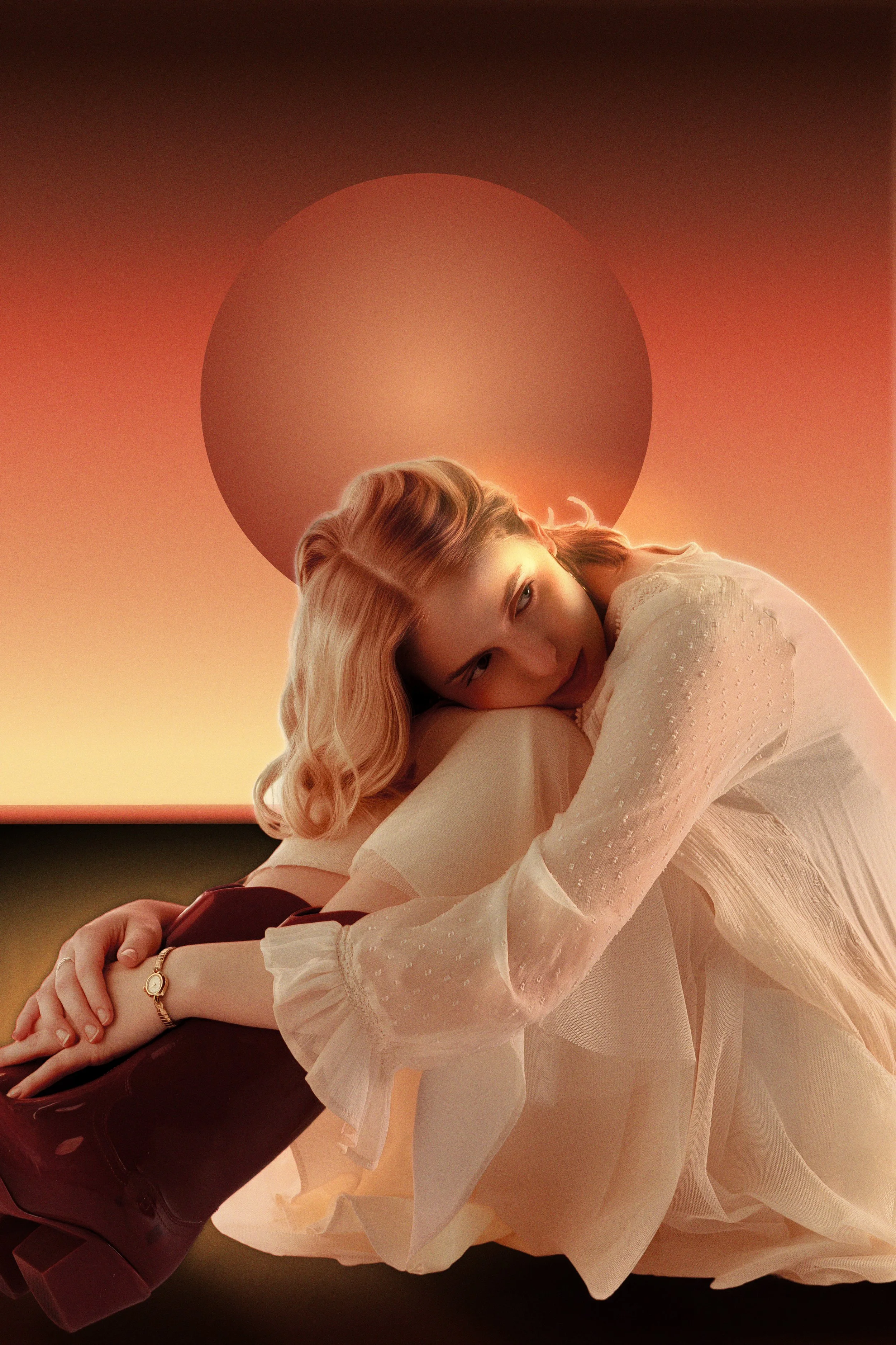 A woman with blonde hair leaning forward, sitting on a surface, wearing a white textured dress with sheer sleeves, and-looking directly at the camera with a soft expression. The background features a large red sun and gradient sky transitioning from 