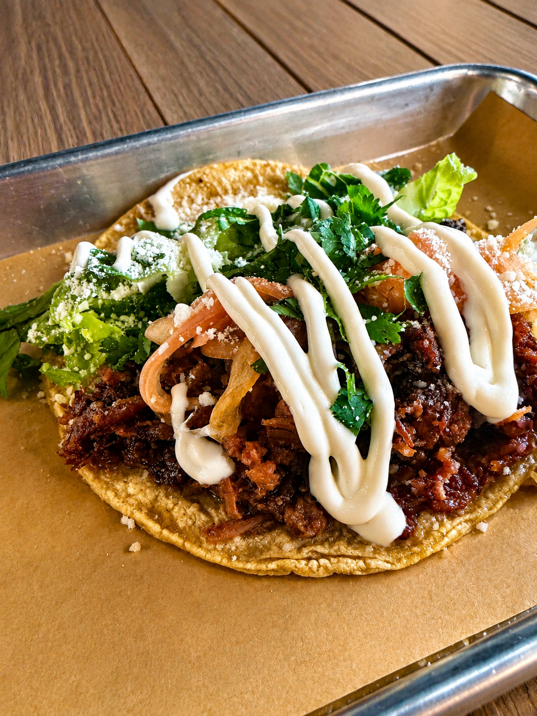 Al Pastor taco with crema