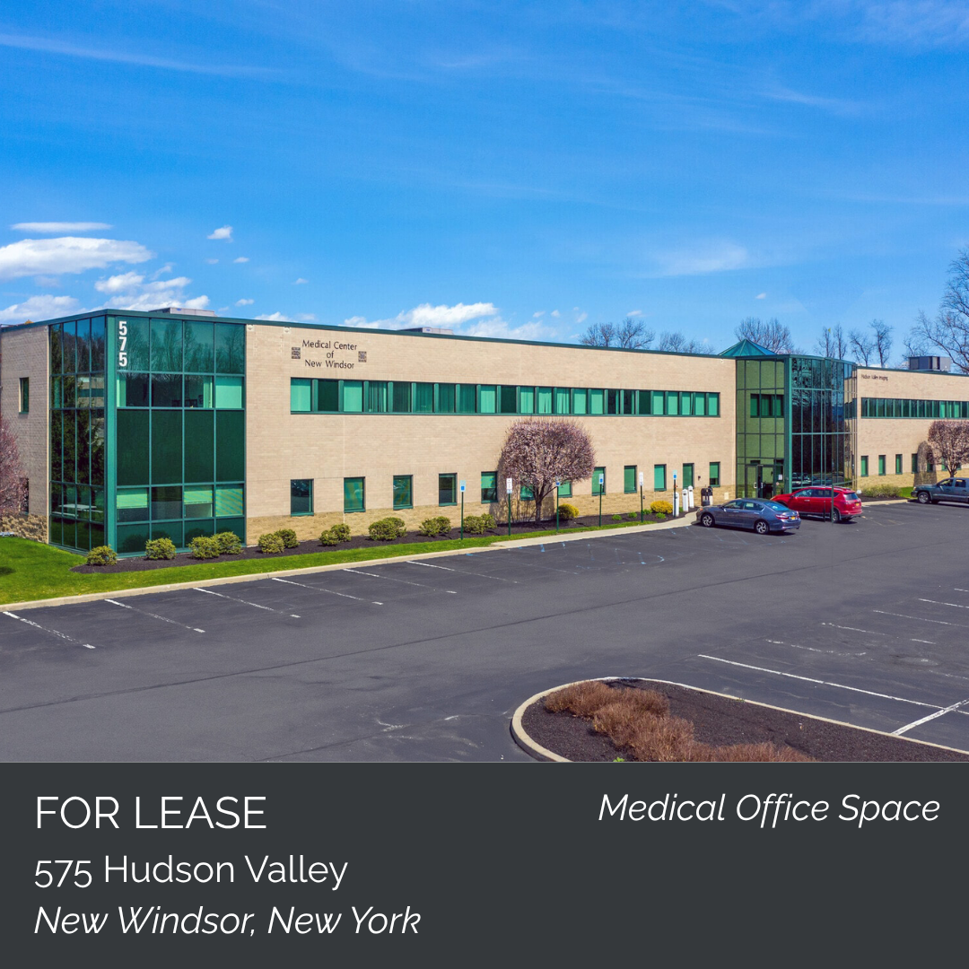 A large, modern medical office building with parking lot in front, labeled for lease at 575 Hudson Valley, New Windsor, New York.