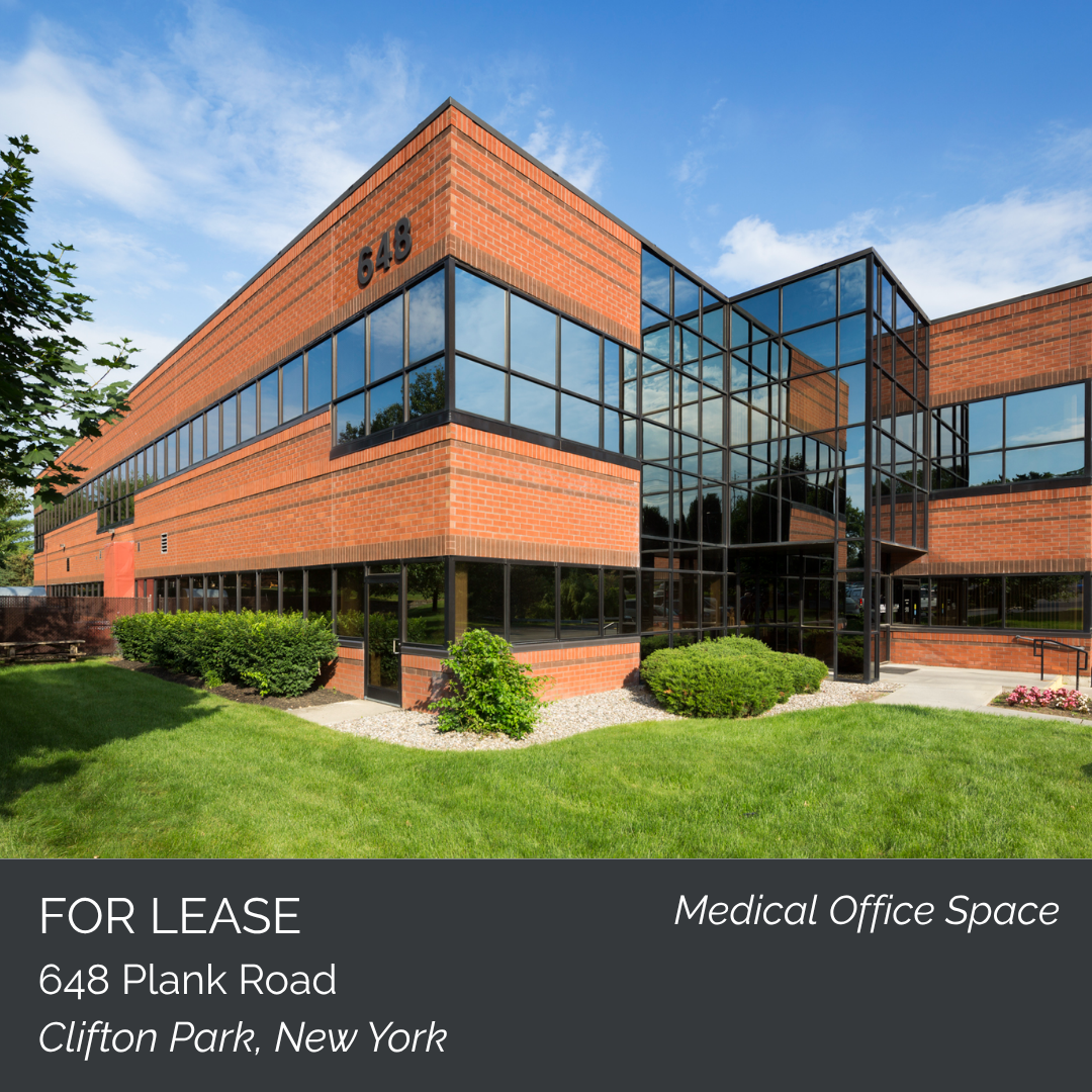 Photo of a modern brick and glass building with the address 648 on it, used for medical office space, located at 648 Plank Road, Clifton Park, New York.