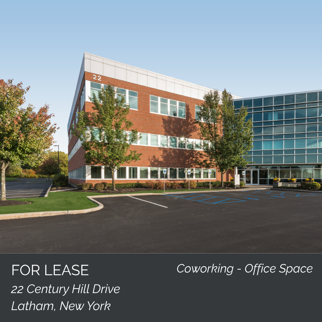 Commercial office building with parking lot and trees, for lease at 22 Century Hill Drive, Latham, New York.