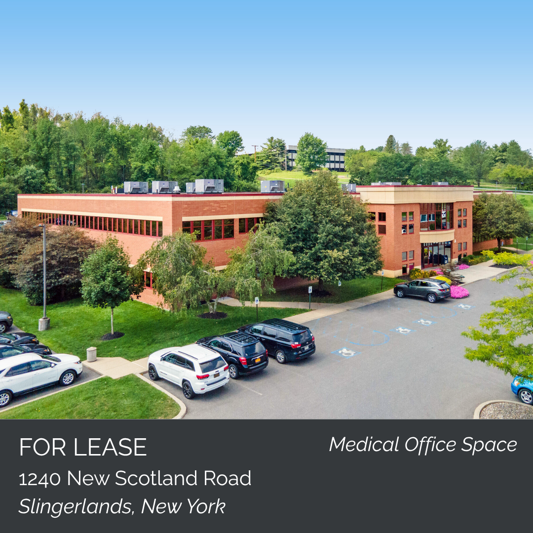 A two-story red-brick medical office building with parking lot and landscaped surroundings, located at 1240 New Scotland Road in Slingerlands, New York, available for lease.