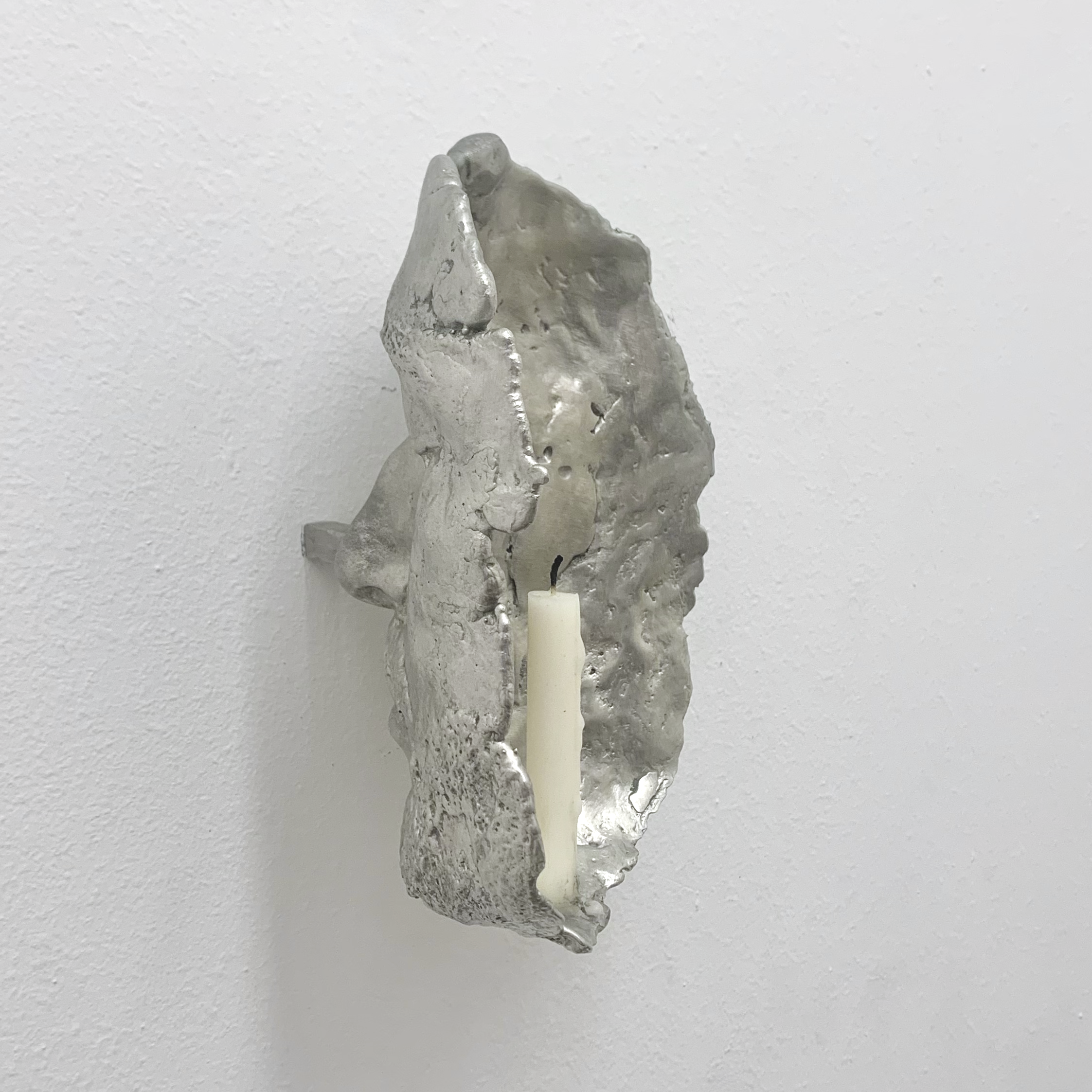 Self-Portrait (Coward), 12cm x 20cm x 13cm, cast tin, steel, candle, 2025