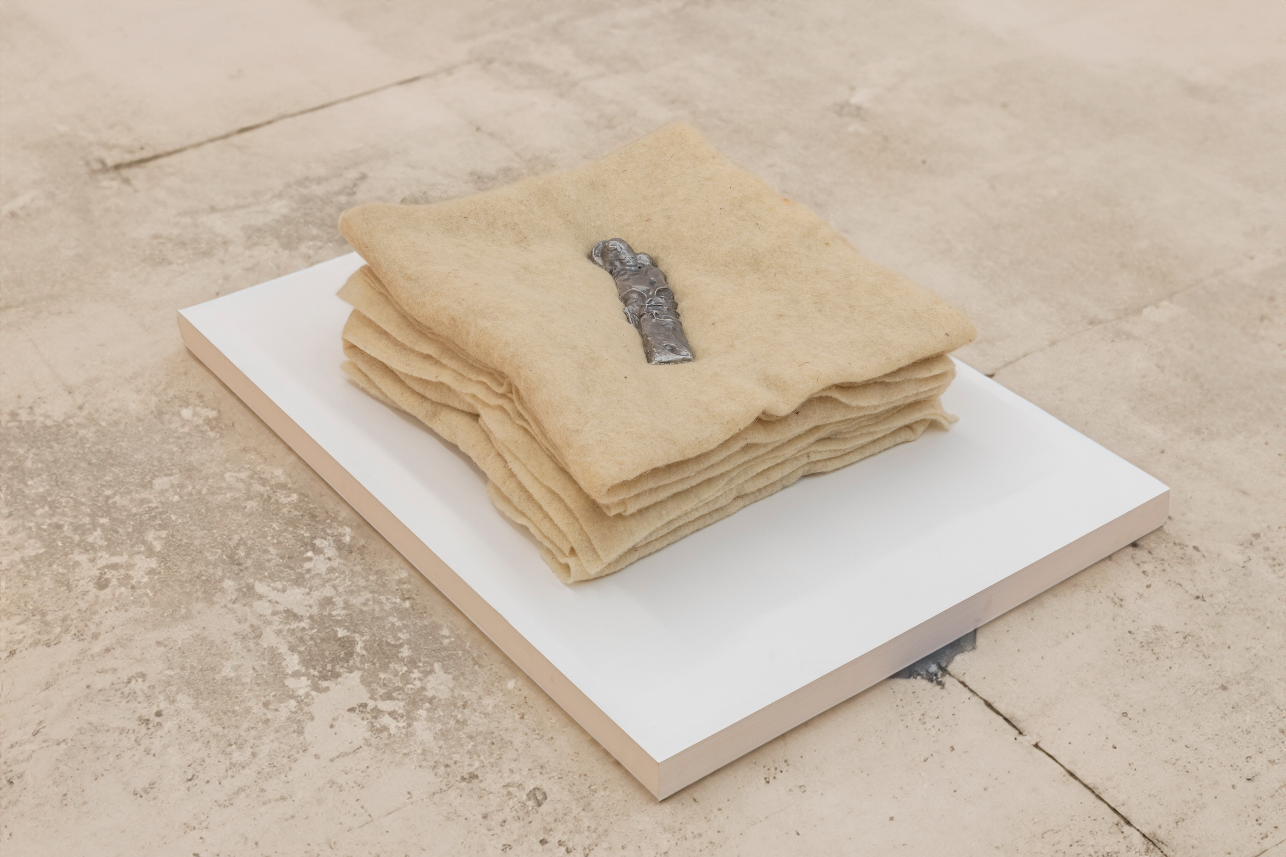 Untitled (Mother and Child), 60cm x 55cm x 18cm, cast lead, sheep wool blankets, 2024