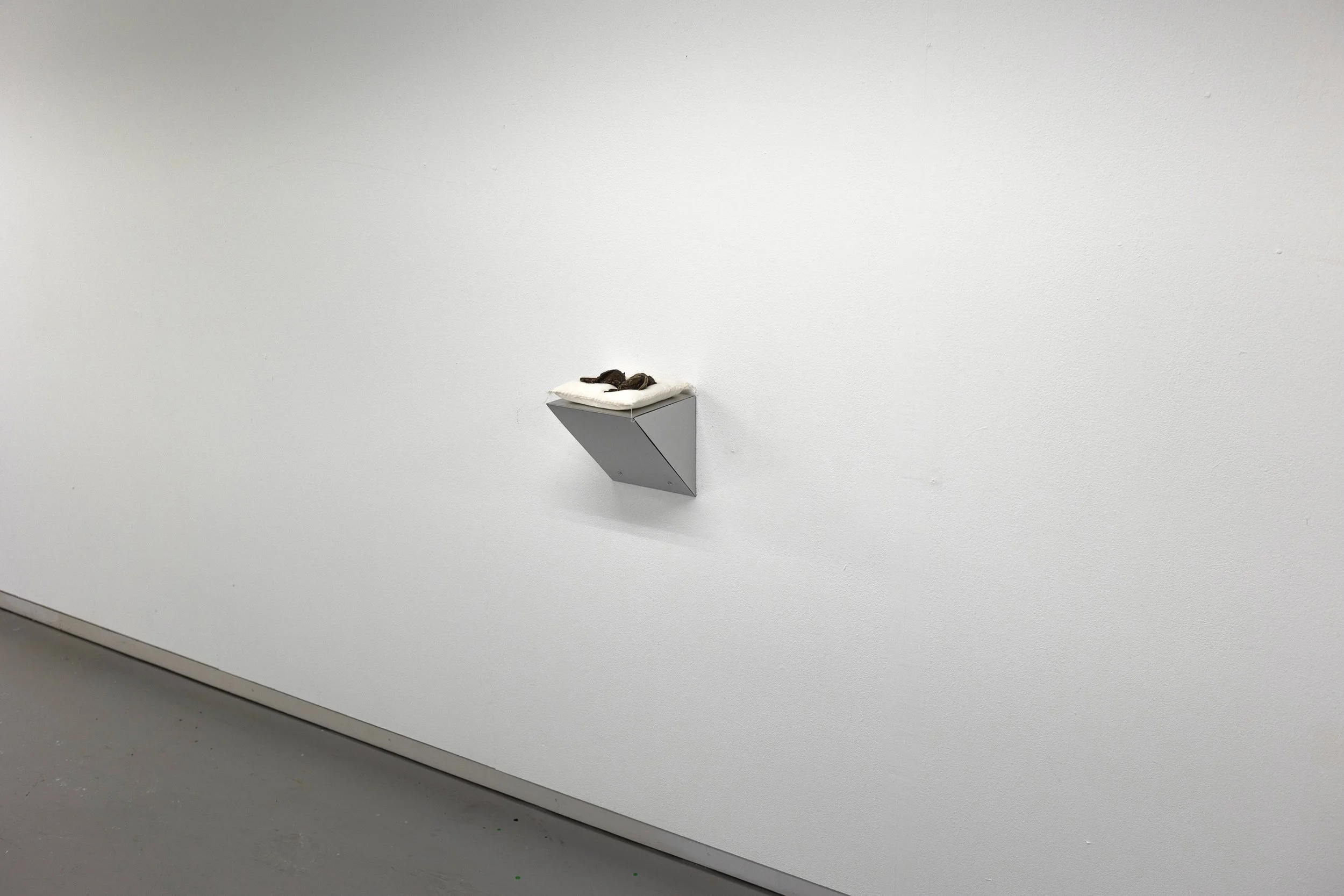 So this is Permanence, 25cm x 20cm x 20cm, bronze on handsewn pillow on aluminum console, 2024