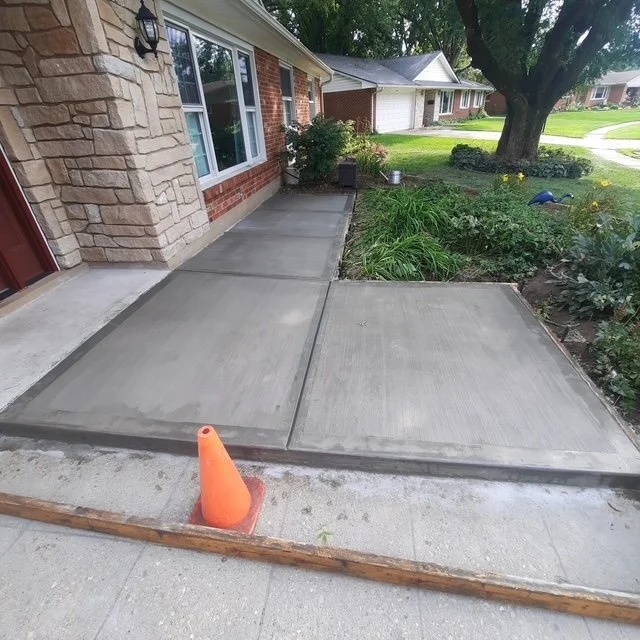 Concrete front walkway installation