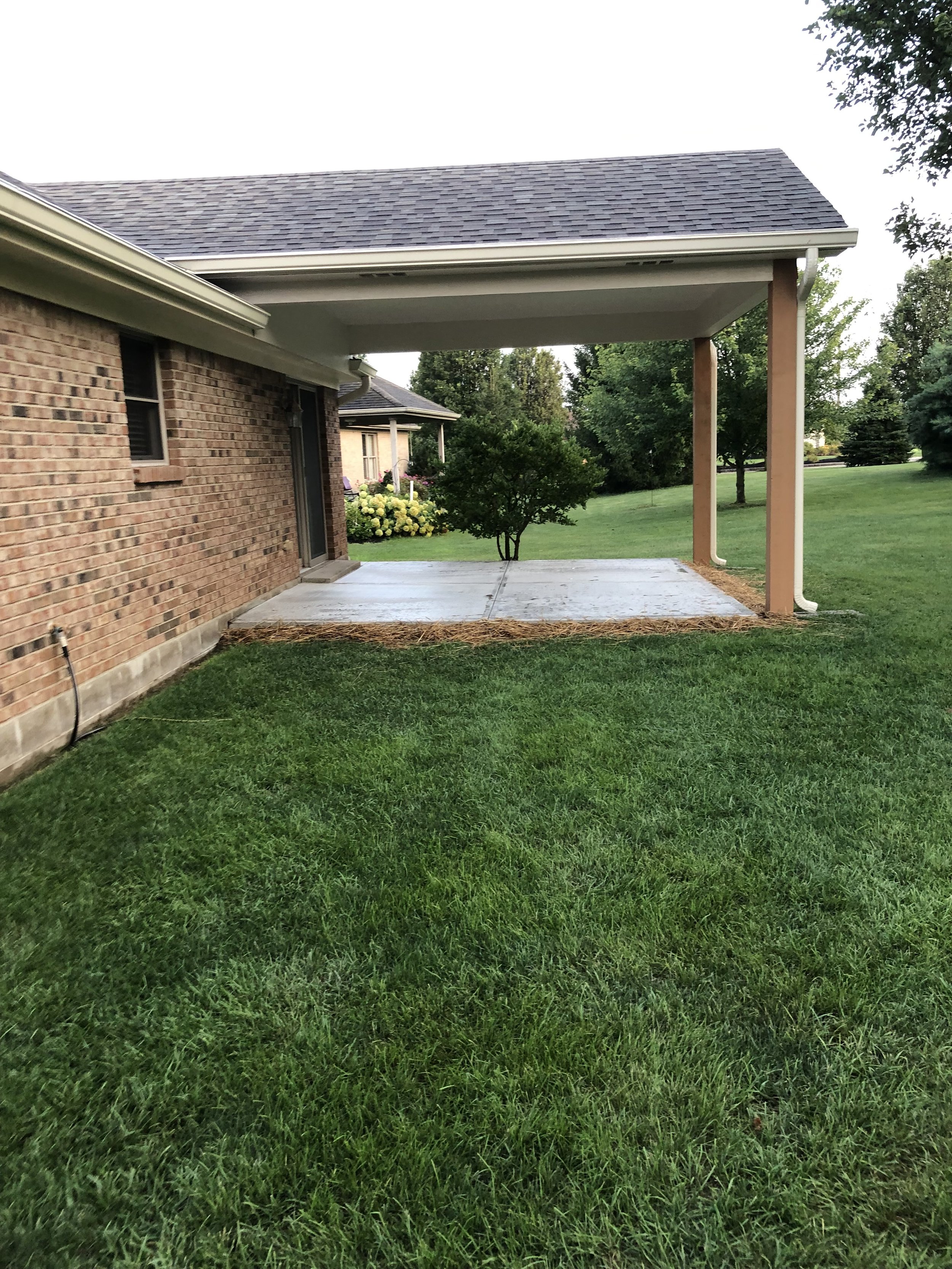 Mason patio cover after side