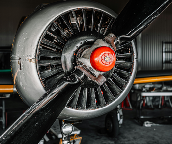 Close-up of single engine propeller aircraft engine during inspection and maintenance for general aviation aircraft
