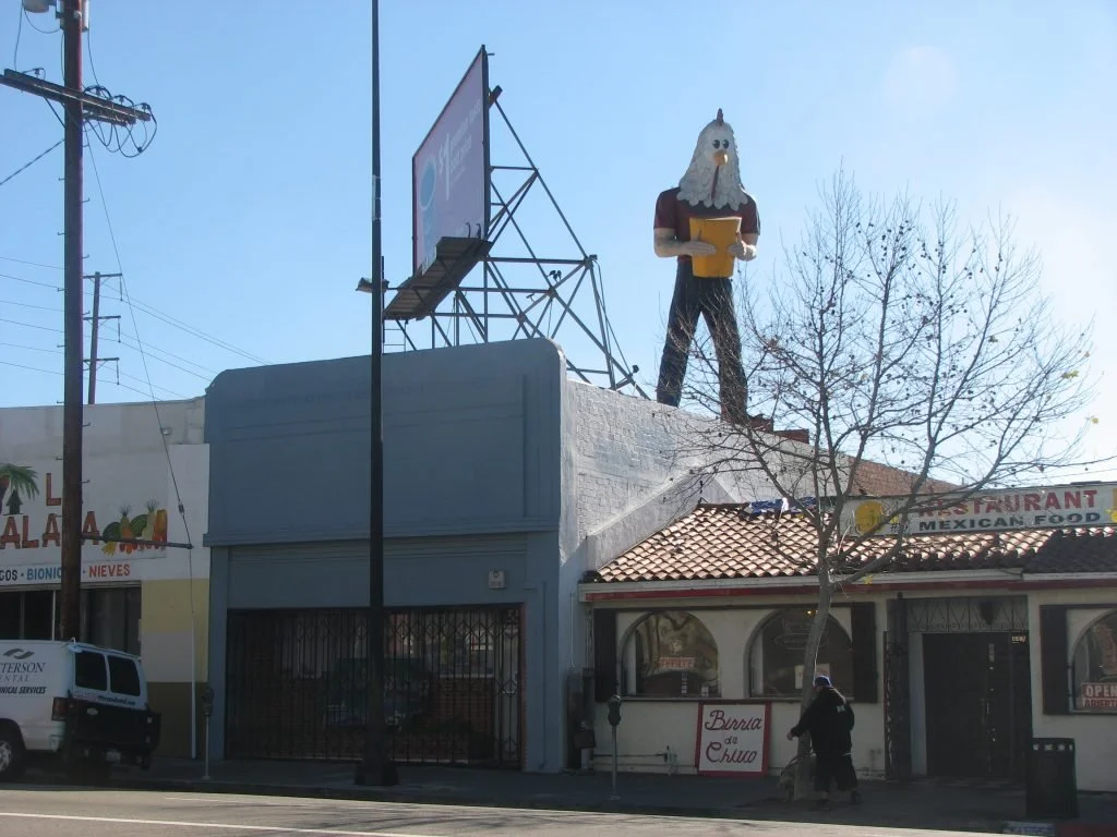 In 1984 the statue of Chicken Boy was removed from the roof over the Chicken Boy restaurant, which had recently closed. Amy Inouye campaigned to save the roadside icon and eventually acquired it and put it into storage. Unable to find a proper new pu