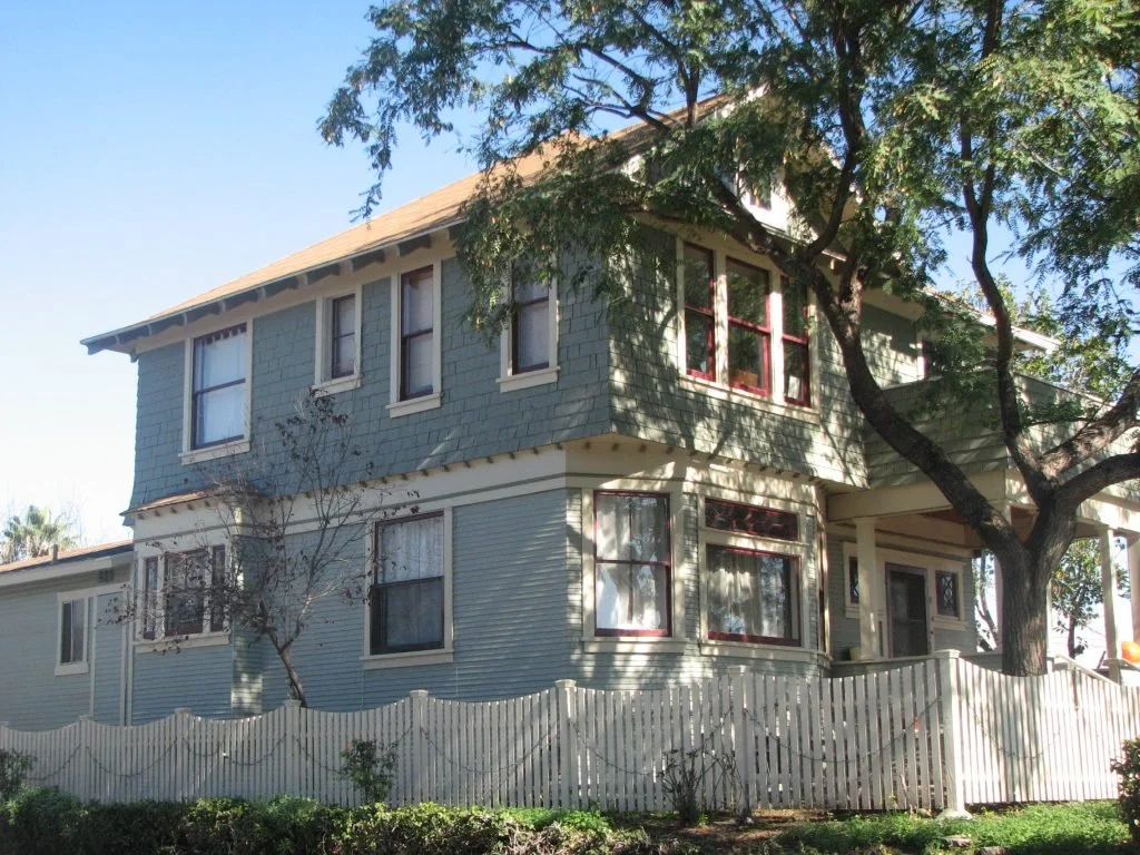 This Four Square known as Gordon House has been returned to its former glory over the last two years. A fire-damaged upper story that had been covered over with plywood has been re-shingled and the windows brought back to their original design. An ol