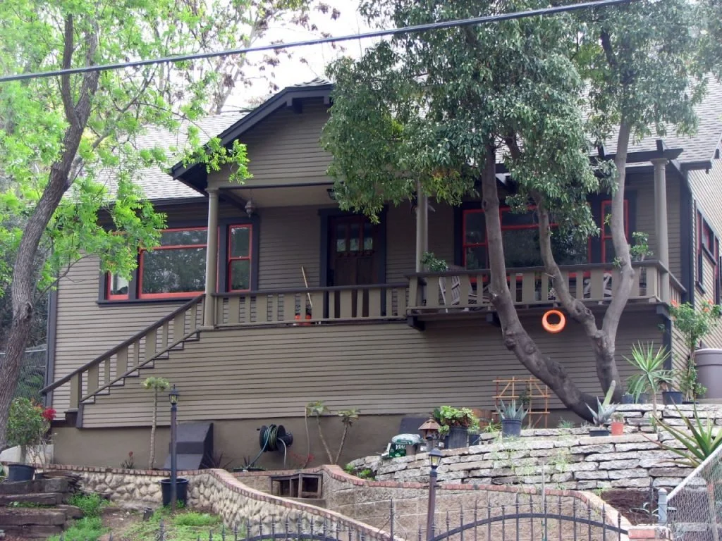 This single story Craftsman at 430 Mount Washington Drive sits high above the street and is once again inhabitable after a new foundation, new roof and a welcome paint job. It features an extended porch roof that is supported by two Tuscan columns. T