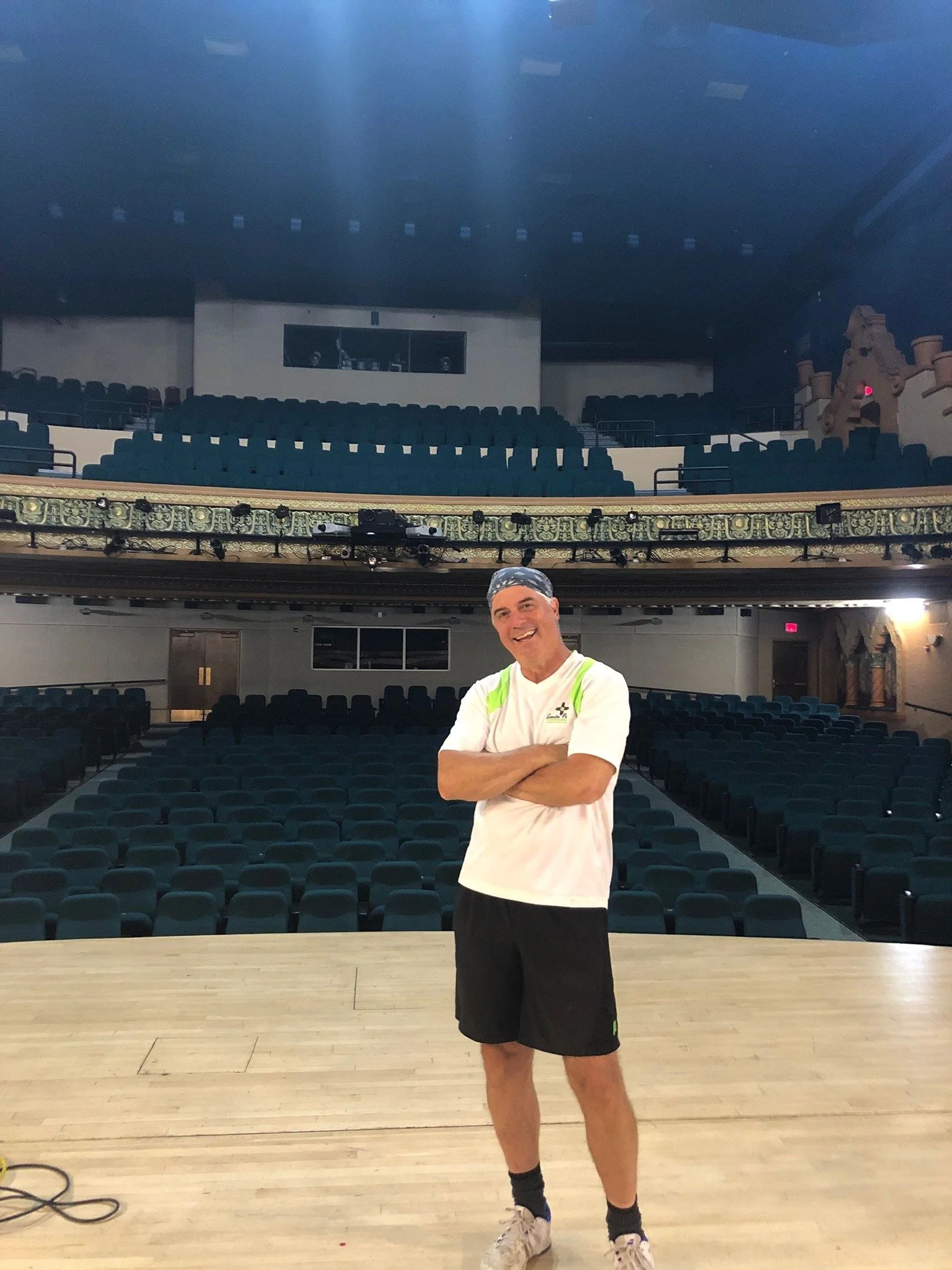 Henry Sutro standing on stage at the Lensic Theater in Santa Fe, NM.  