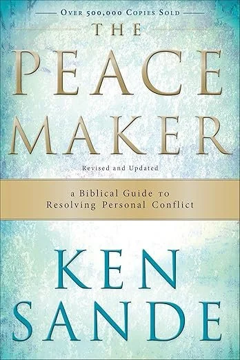 Cover of the book titled "The Peace Maker: A Biblical Guide to Resolving Personal Conflict" by Ken Sande, featuring a blue and beige color scheme with text highlighting over 500,000 copies sold.