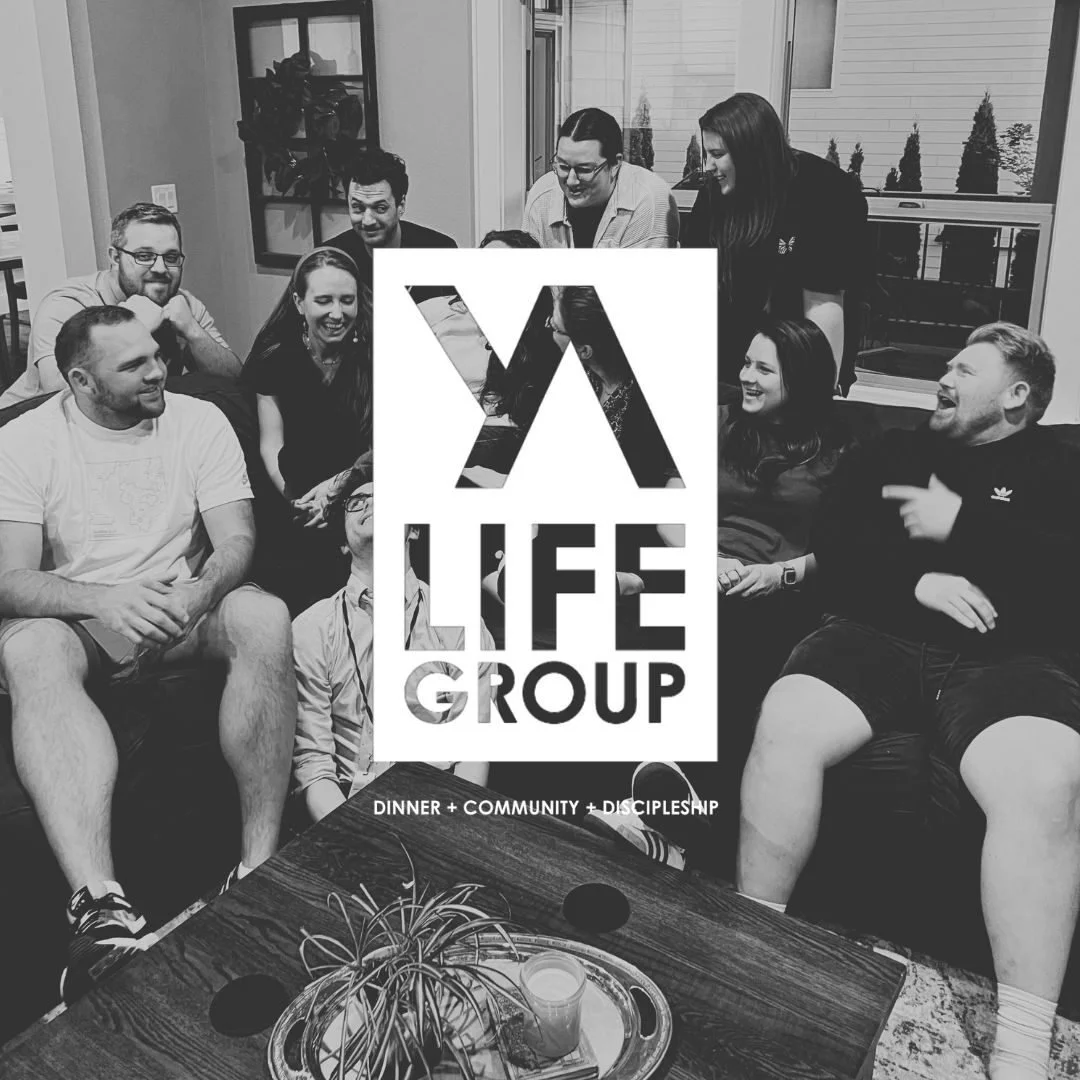 A group of people gathered in a living room, smiling and laughing, with a large sign reading 'Life Group' in the center, and words 'Dinner, Community, Discipleship' at the bottom.