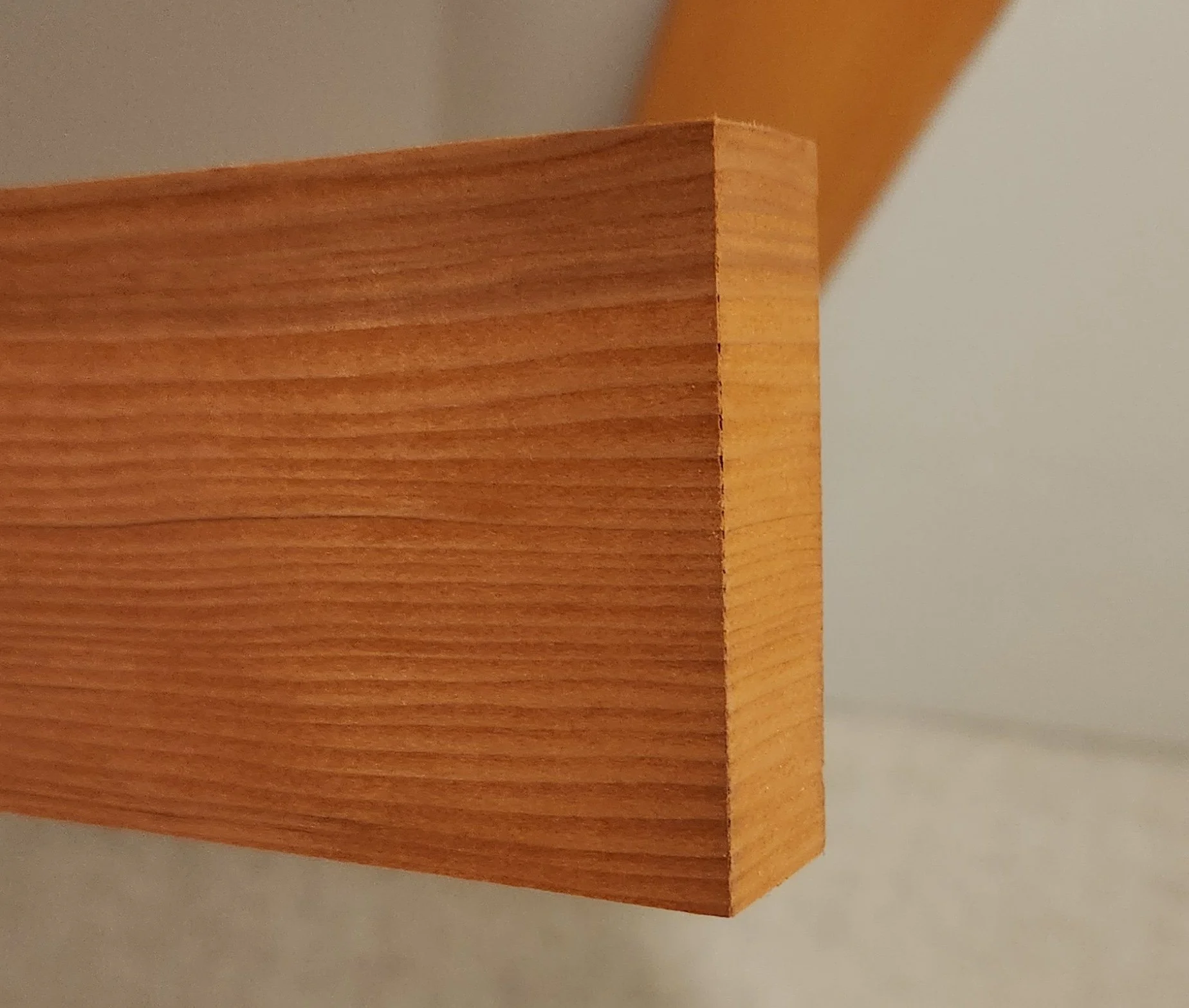 Close-up of a stain grade header, showcasing the grain matched return on the end.