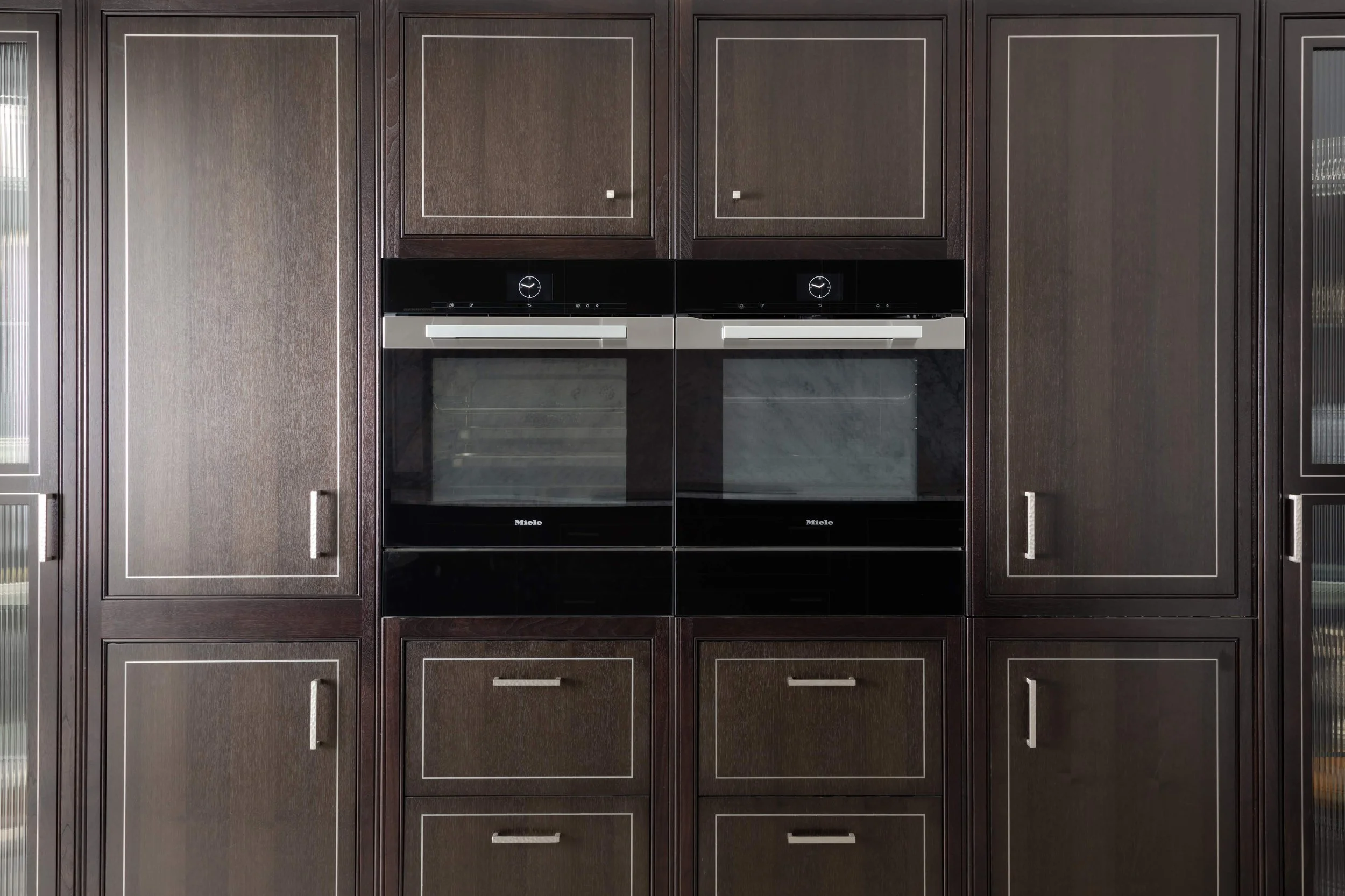 Clive Christian cabinetry detail with built-in double ovens.