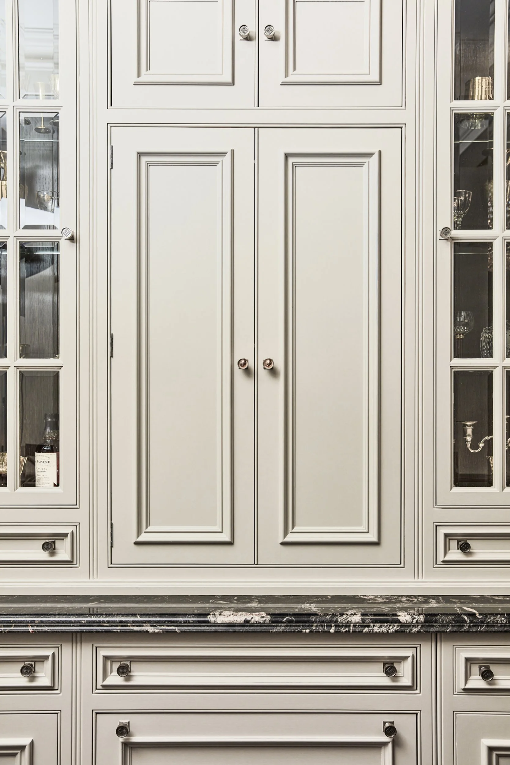 Clive Christian cabinetry detail with beveled glass doors.