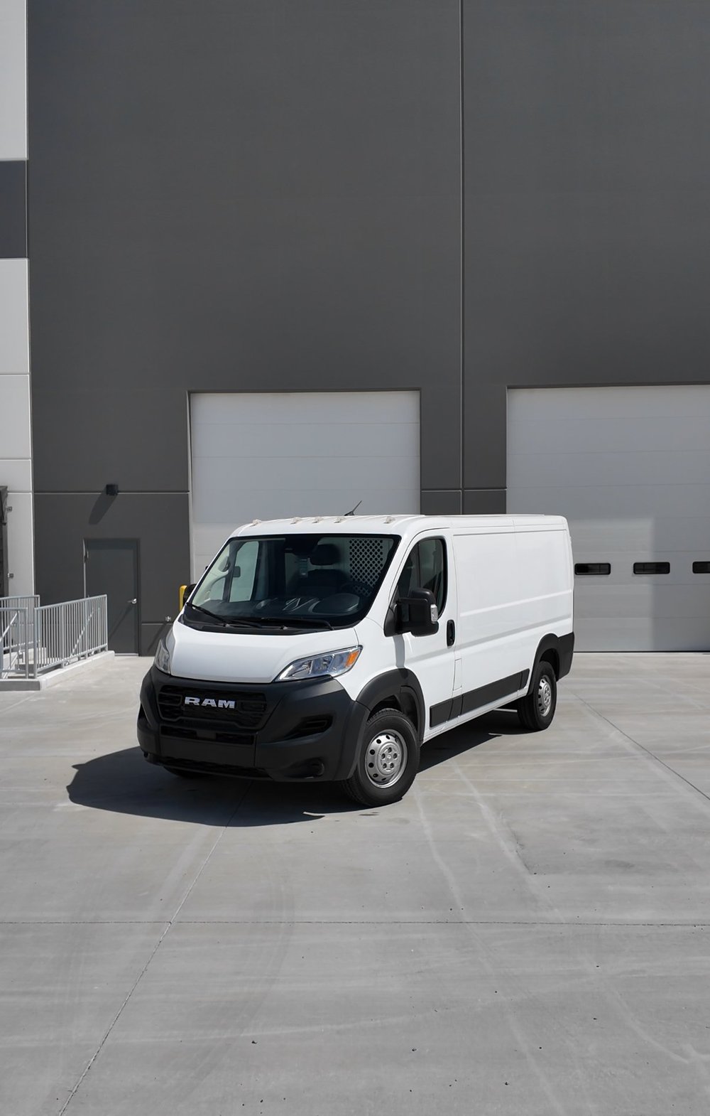 A plain white work van before a commercial wrap is installed