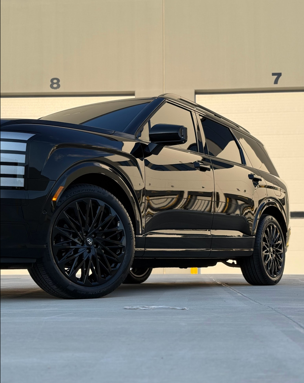 The same Palisade after its wheels were powder coated gloss black at Zeal Restyling in Bluffdale, Utah