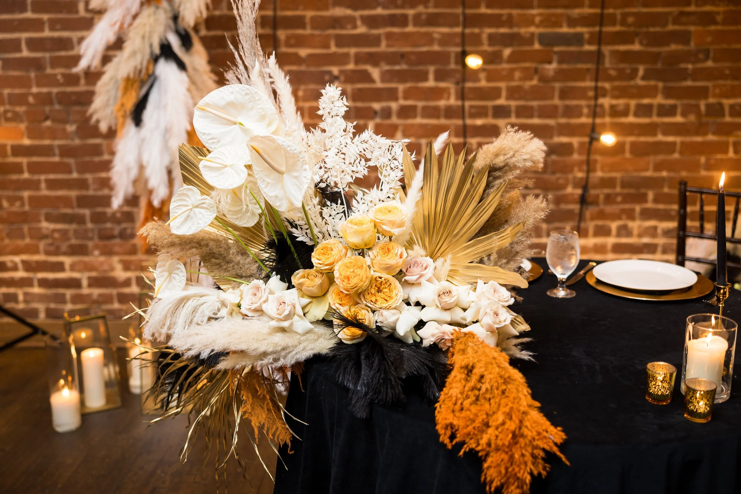 large floral arrangement with dried and live flowers at wedding reception