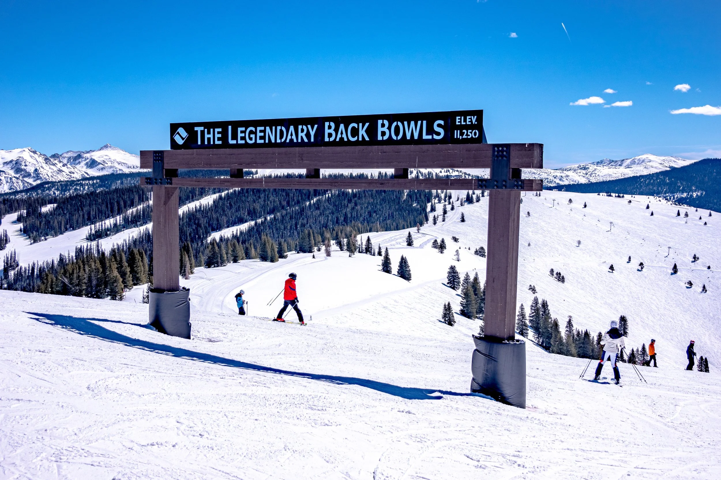 Skiers on the legendary back bowls of Vail ski resort