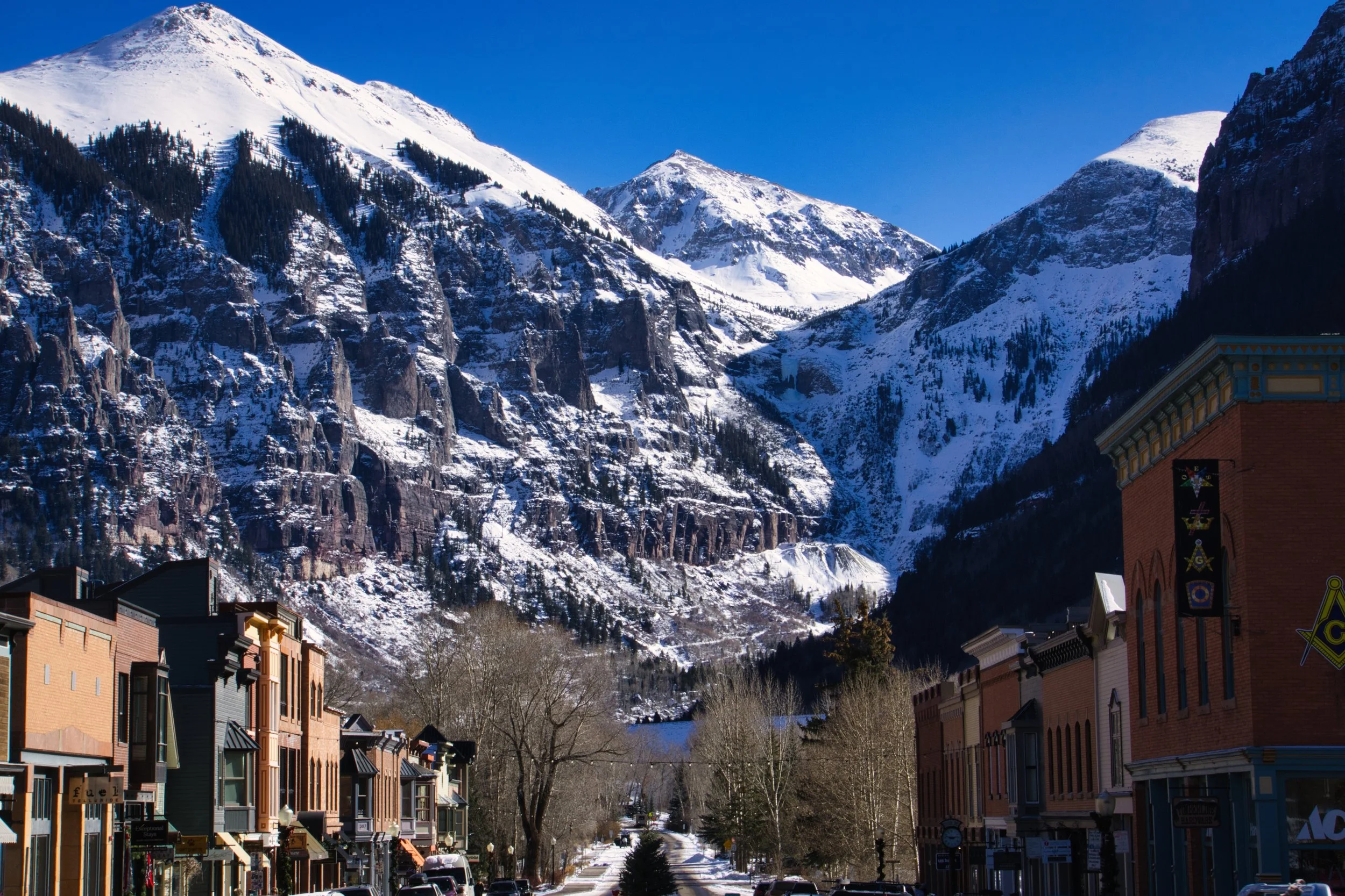 The valley town of Telluride, Colorado, with snow-covered mountains in the background