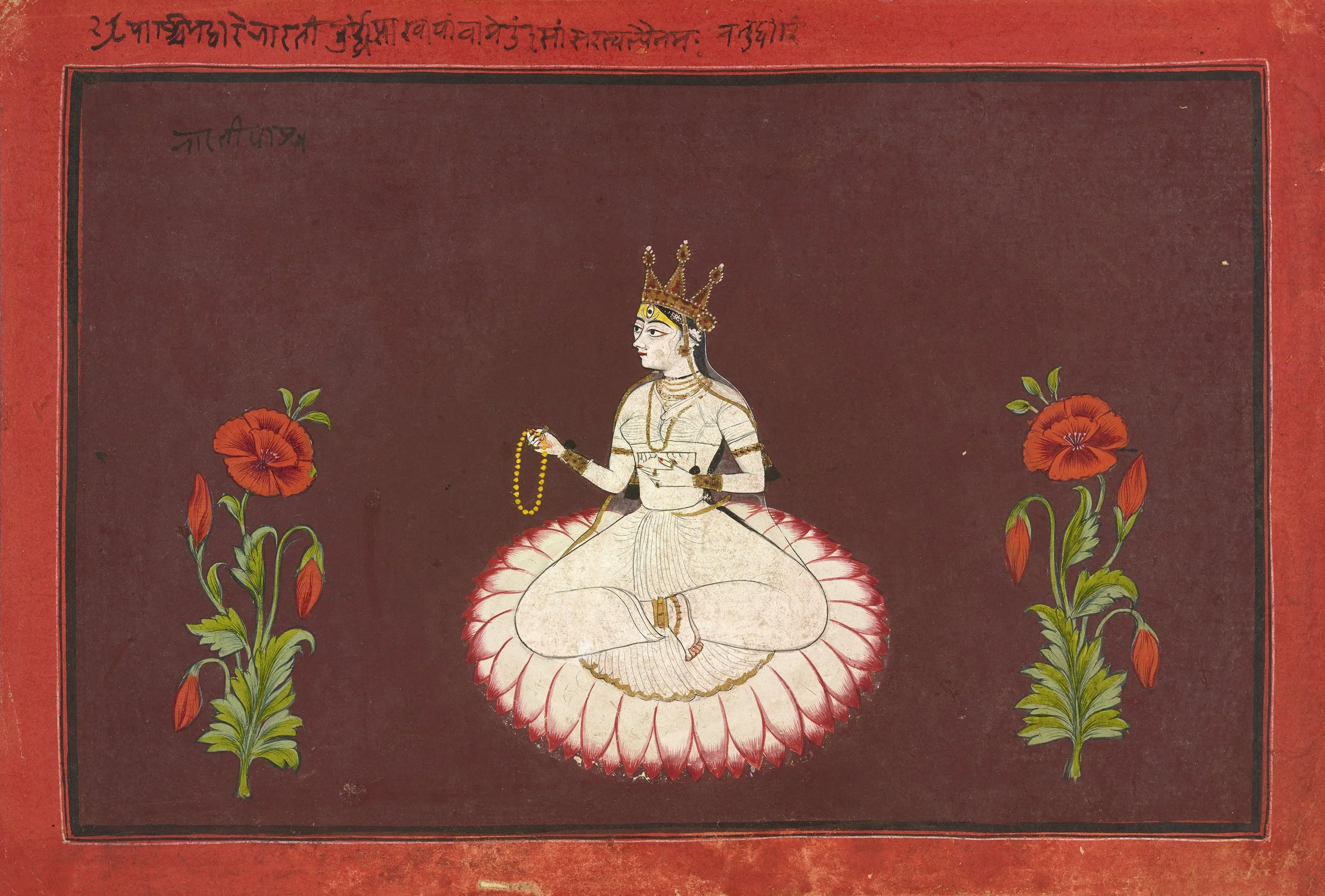 A traditional Indian painting of a seated man with a crown, holding a rosary in one hand and a sword in the other, sitting on a lotus flower surrounded by two red flowers and green leaves, with red and black borders and script in an Indian script at the top.
