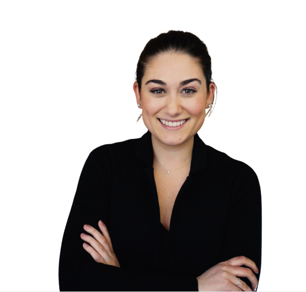 Portrait of a smiling young woman with dark hair in a bun, wearing earrings, a delicate necklace, and a black top against a plain white background.