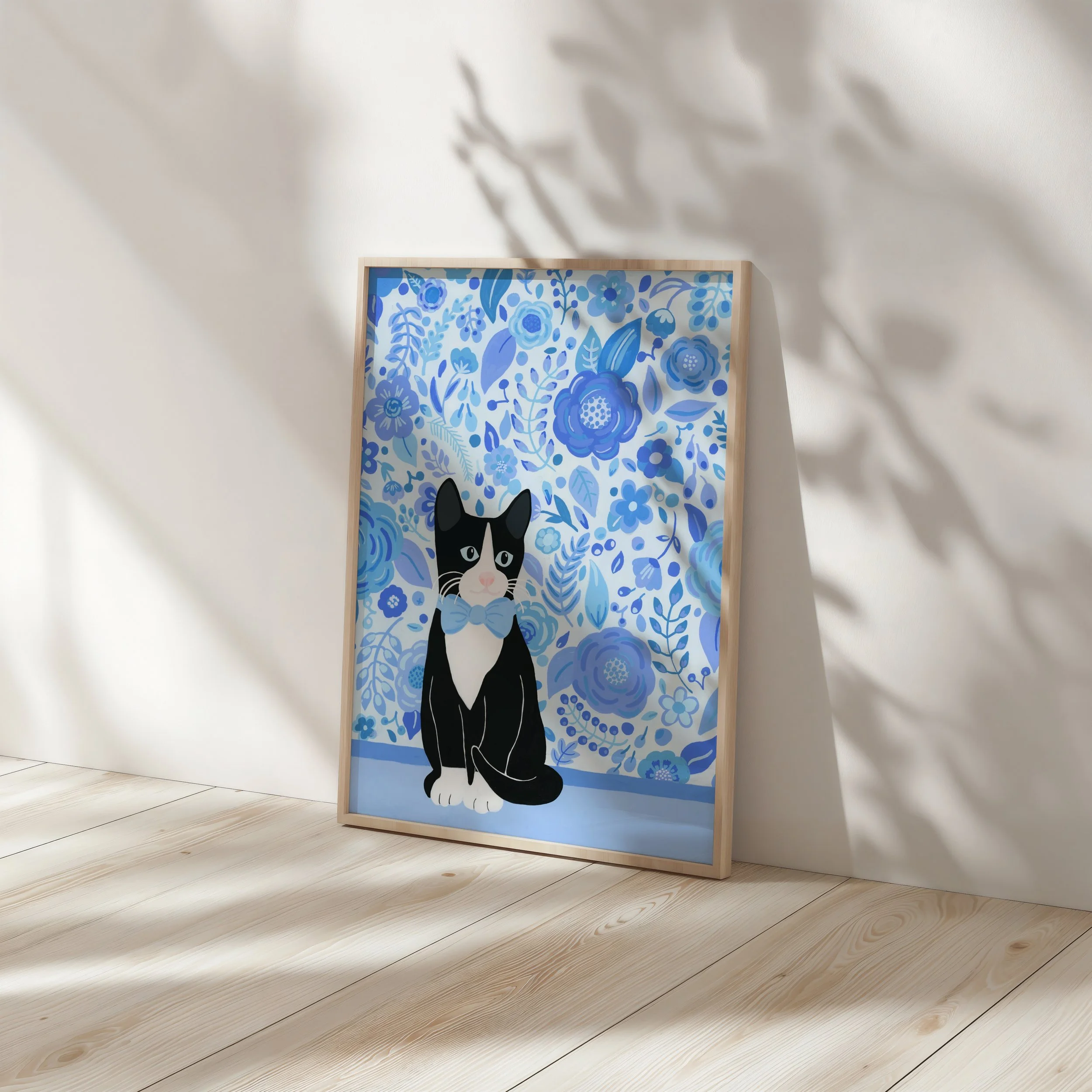 Art print of a tuxedo cat against a wall