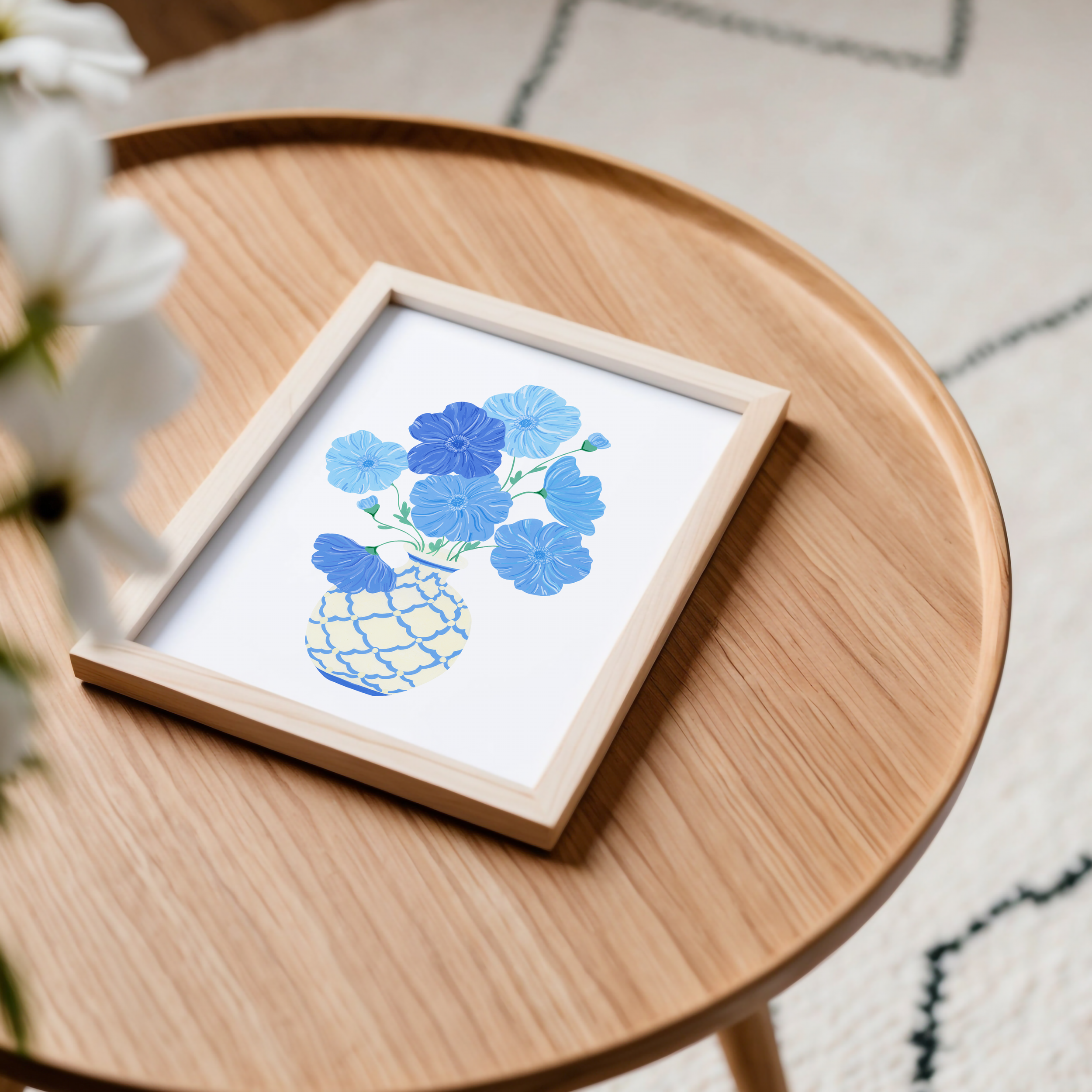 Framed art print of blue poppies on a table