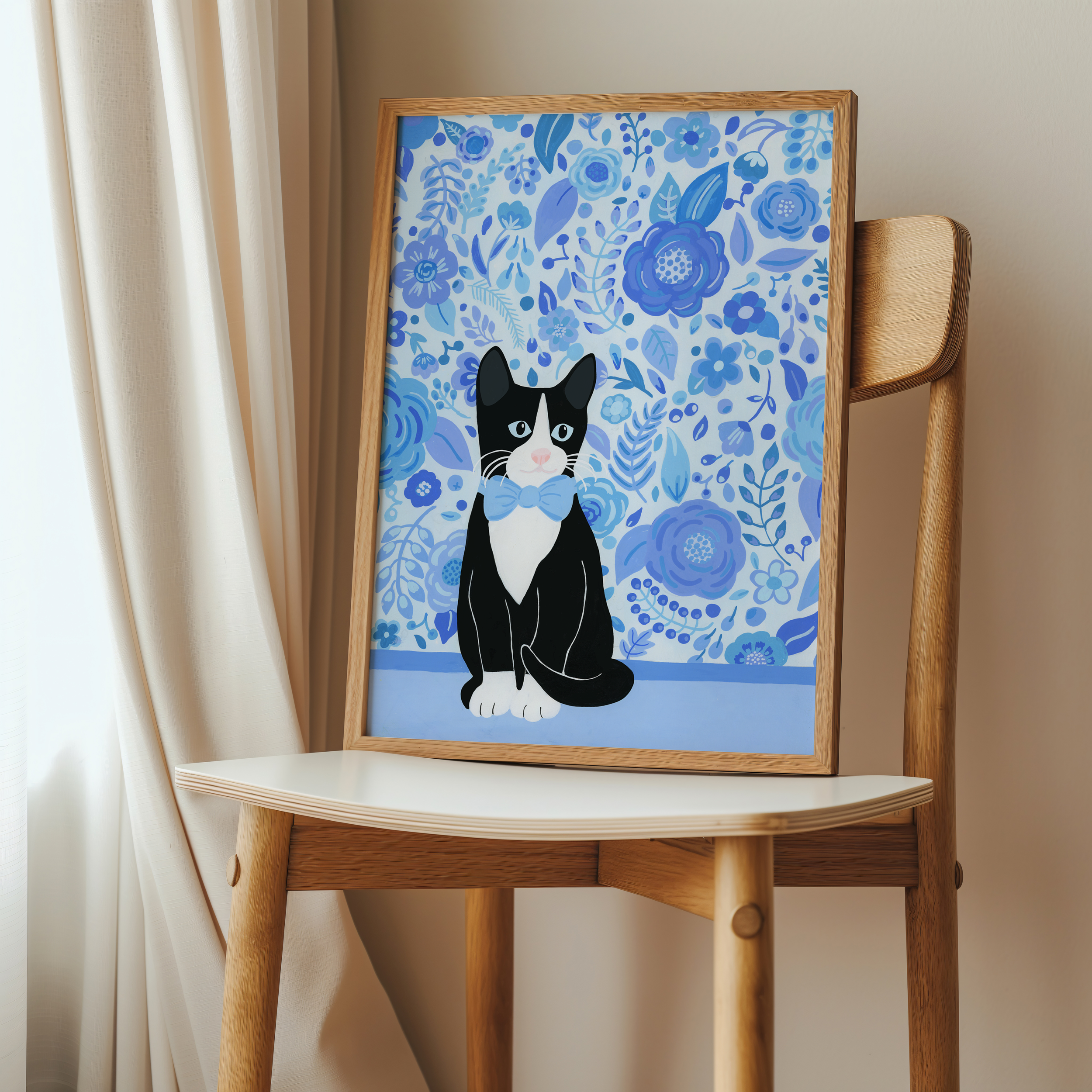 Art print of a tuxedo cat in a big wooden frame