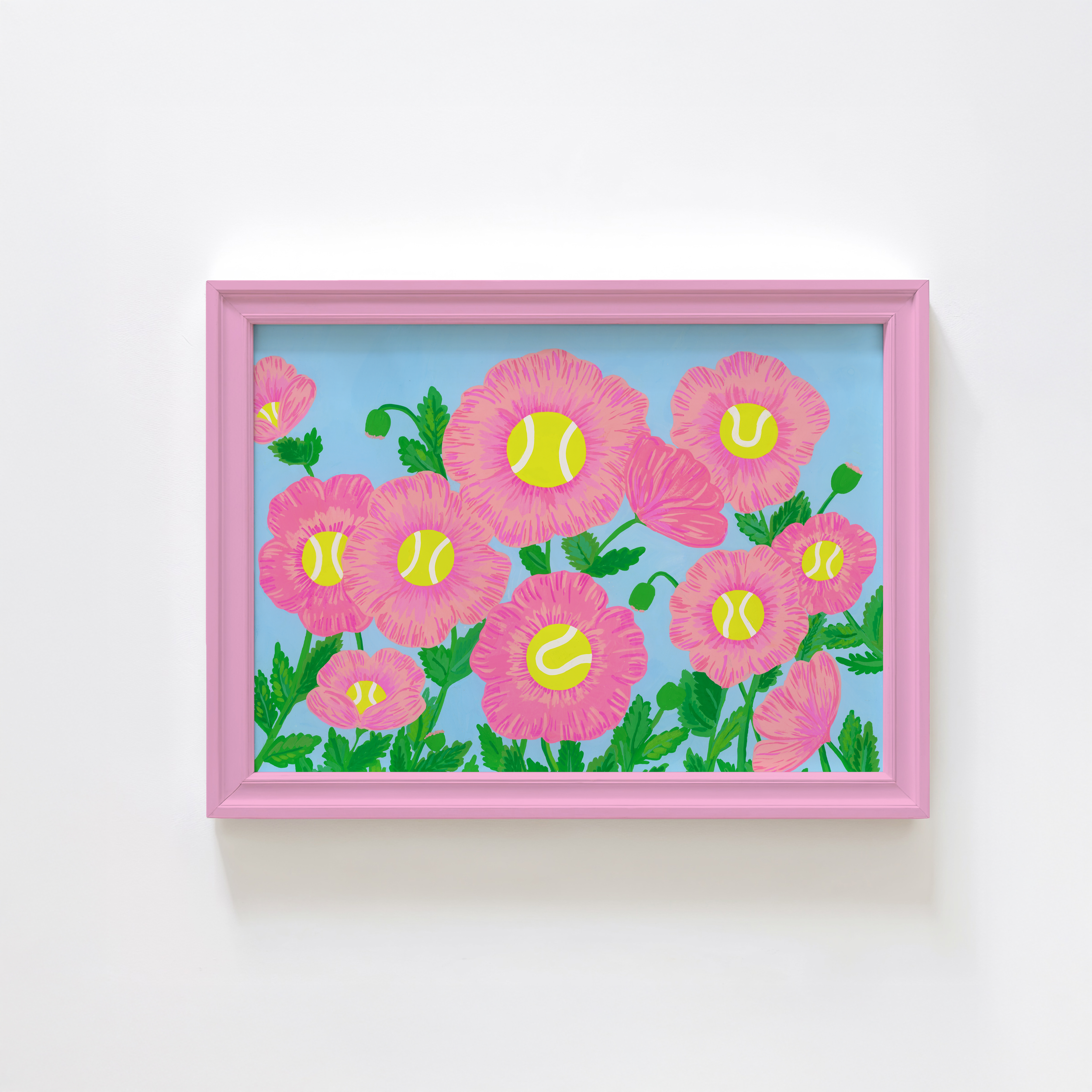 Art print of pink flowers with tennis ball centers in a pink frame.