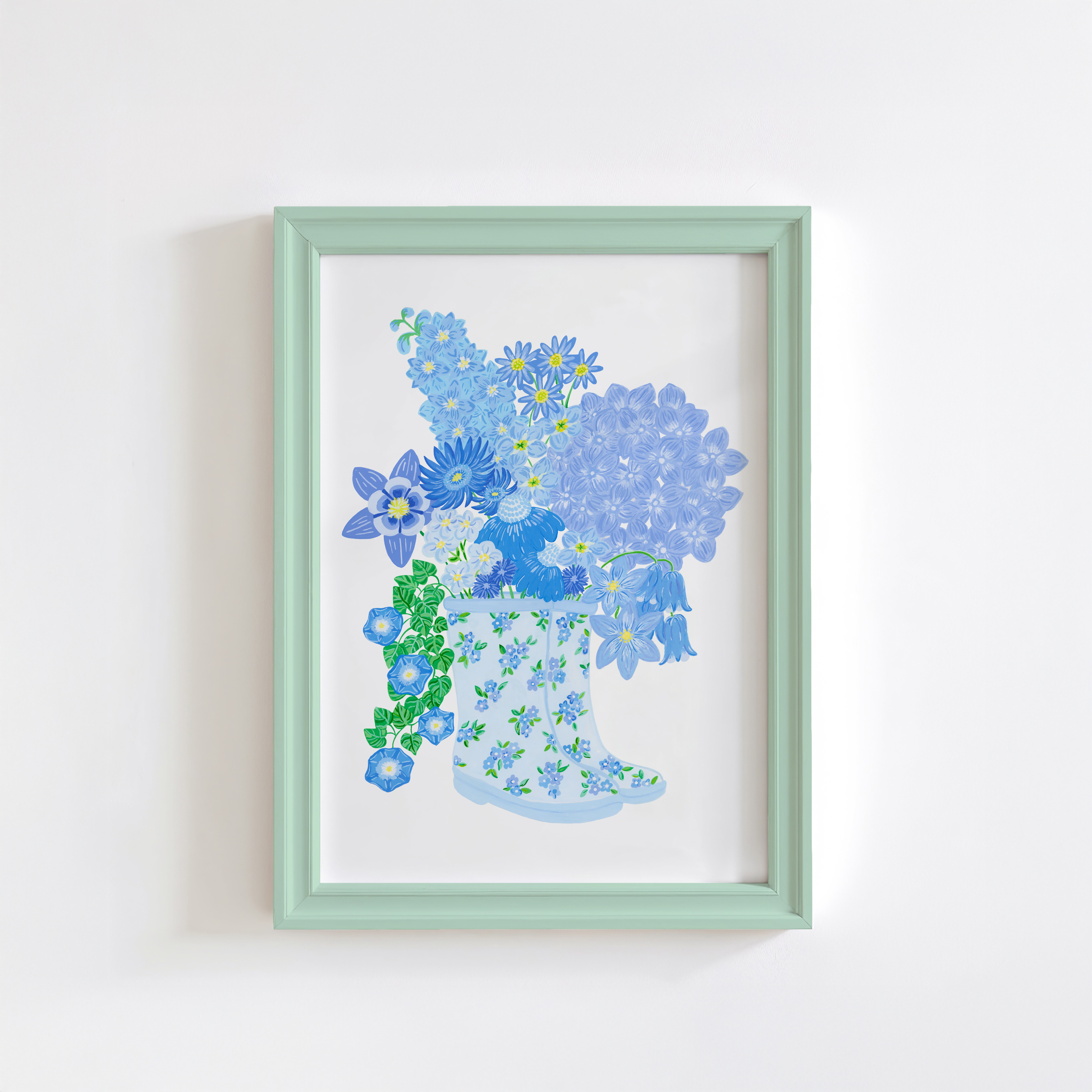 Art print of blue rain boots with blue flowers in a green frame