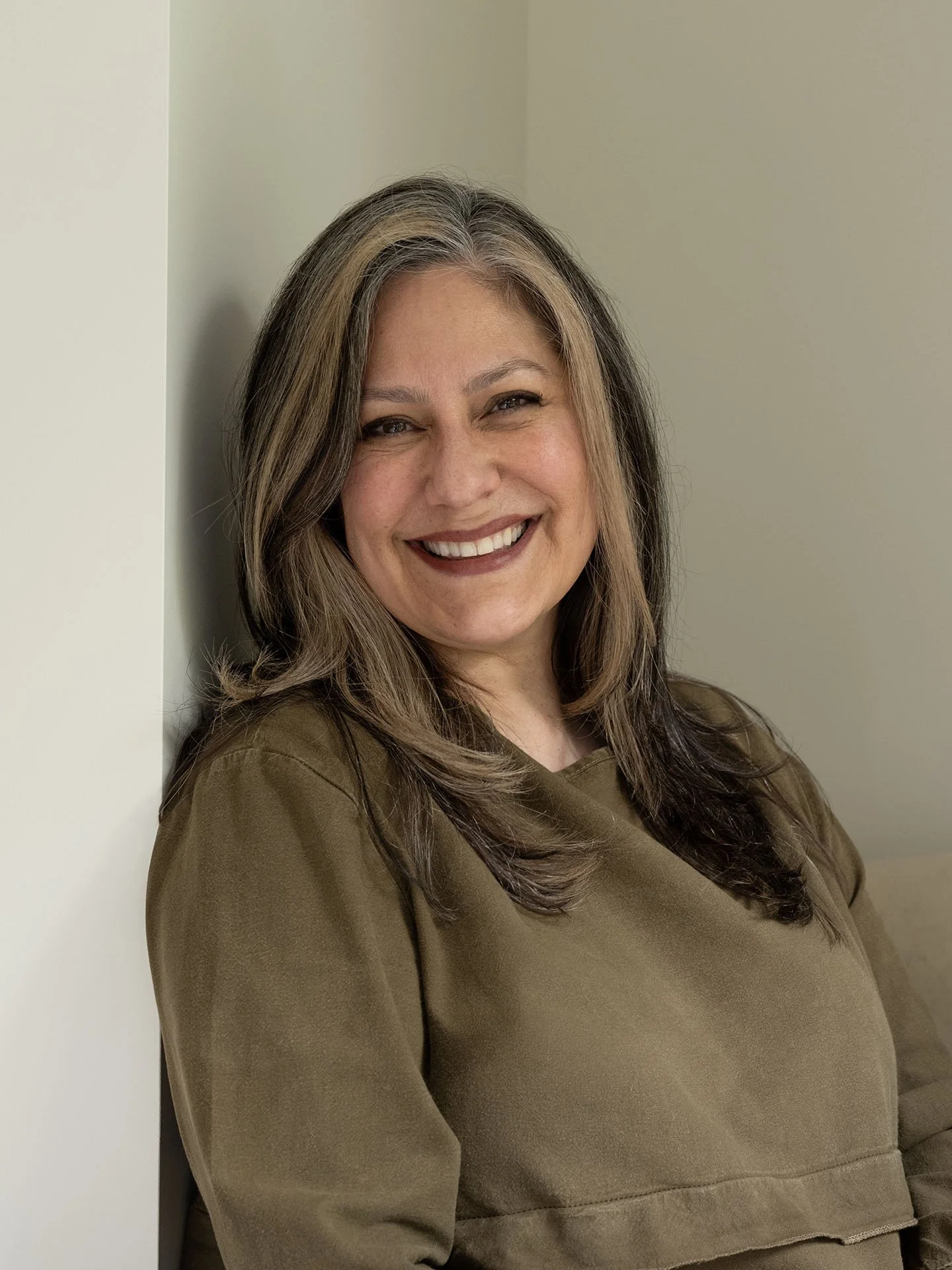 Ingrid Suess-Harkleroad, founder of Seattle Intuitive, smiling.