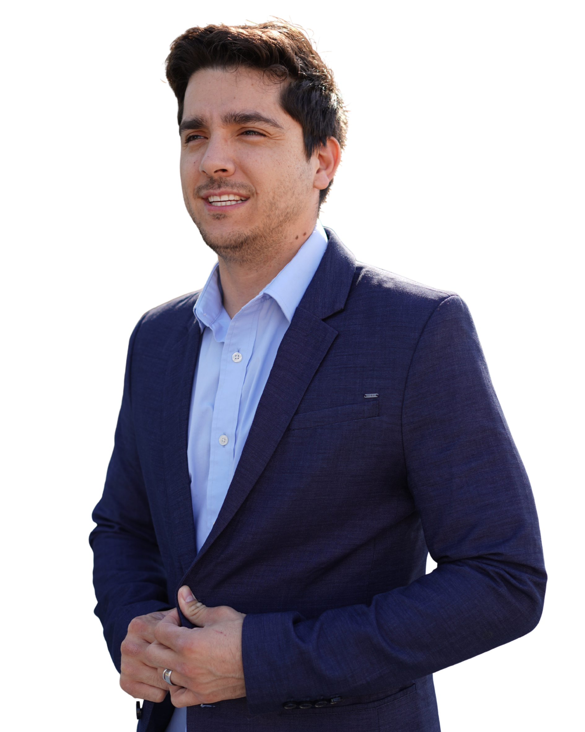 Abel Chavez standing against a dark background.