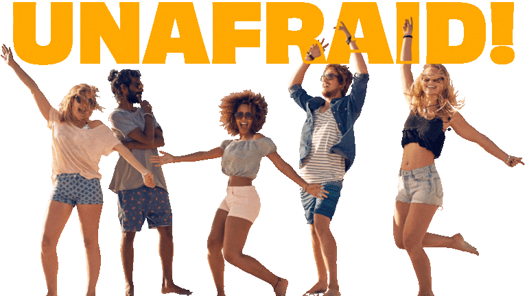 Group of five young adults outdoors holding hands, smiling, with large orange text 'UNAFRAID' in the background.
