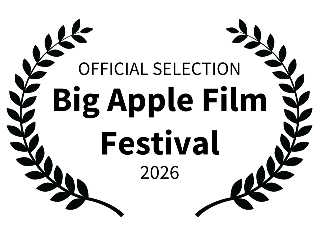 Award medal with a ribbon and laurel wreath design.