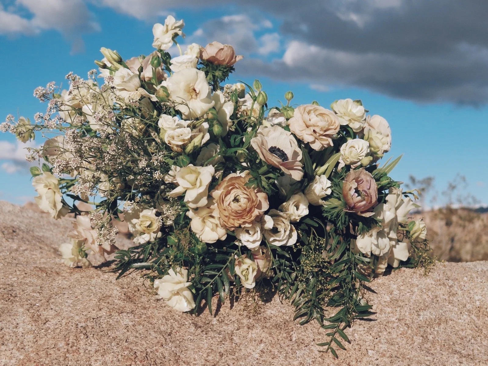 Image with flower arrangement on desert rocks