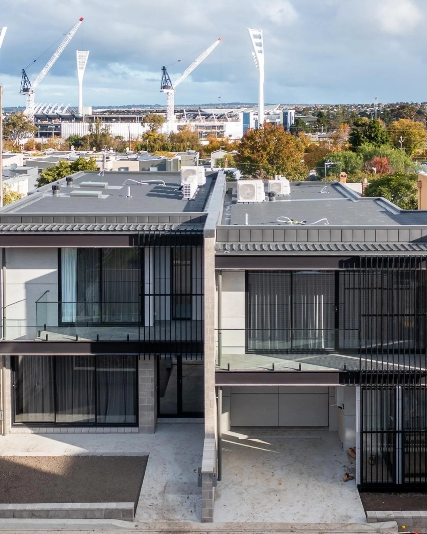 Two townhouses side by side, two different vibes