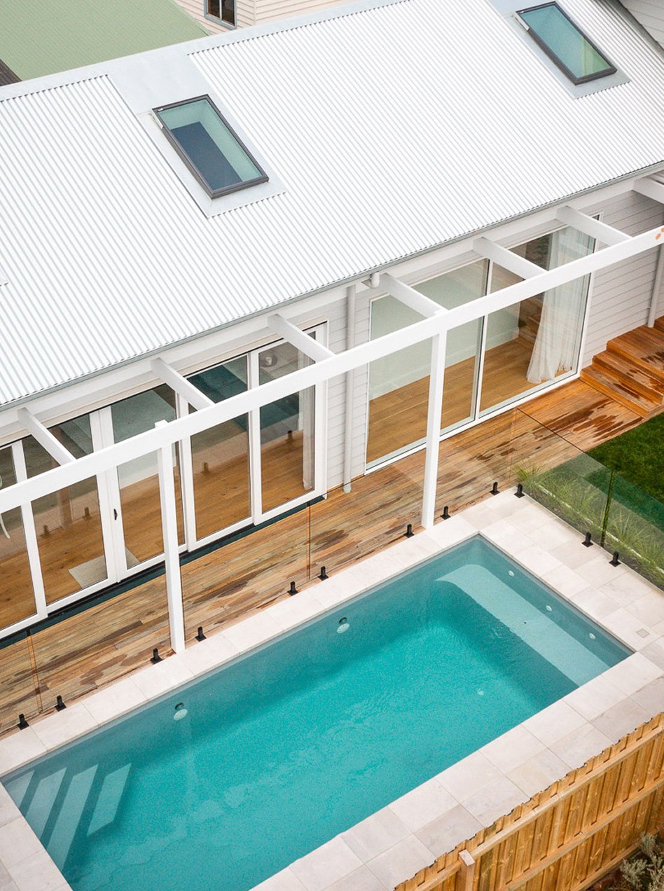 Seamless home extension in Herne Hill, Geelong featuring a timber deck, pergola and pool integration by Geelong Building Co.