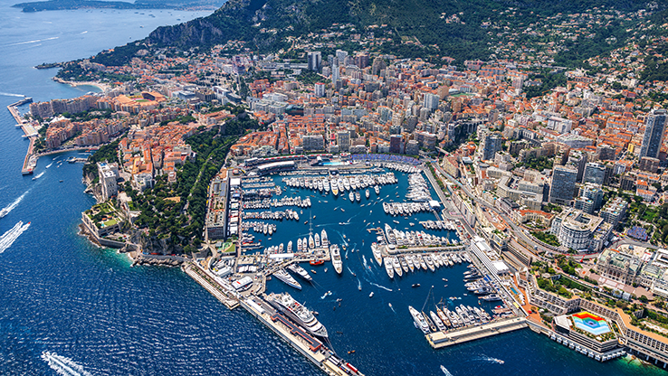 UHNW  investors in  harbor with numerous yachts and boats docked,