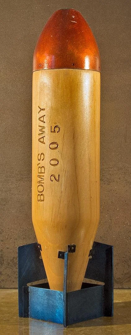Dan Tague (now Charbonnet),   Bombs Away,  3.5" x 13"